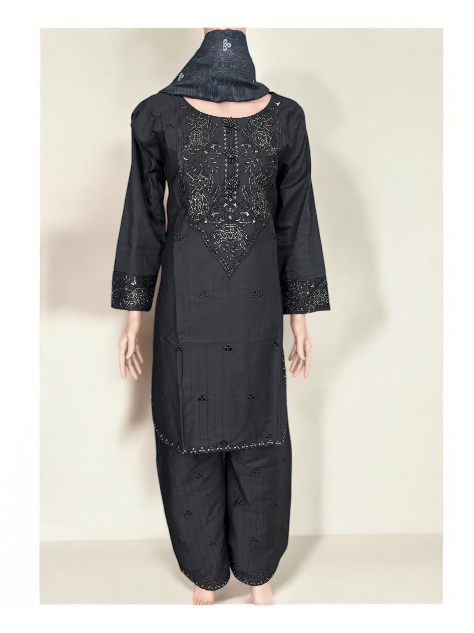 Traditional Pakistani Salwar Kameez by Saree Ghor Charlotte featuring intricate embroidery and vibrant ethnic wear for women