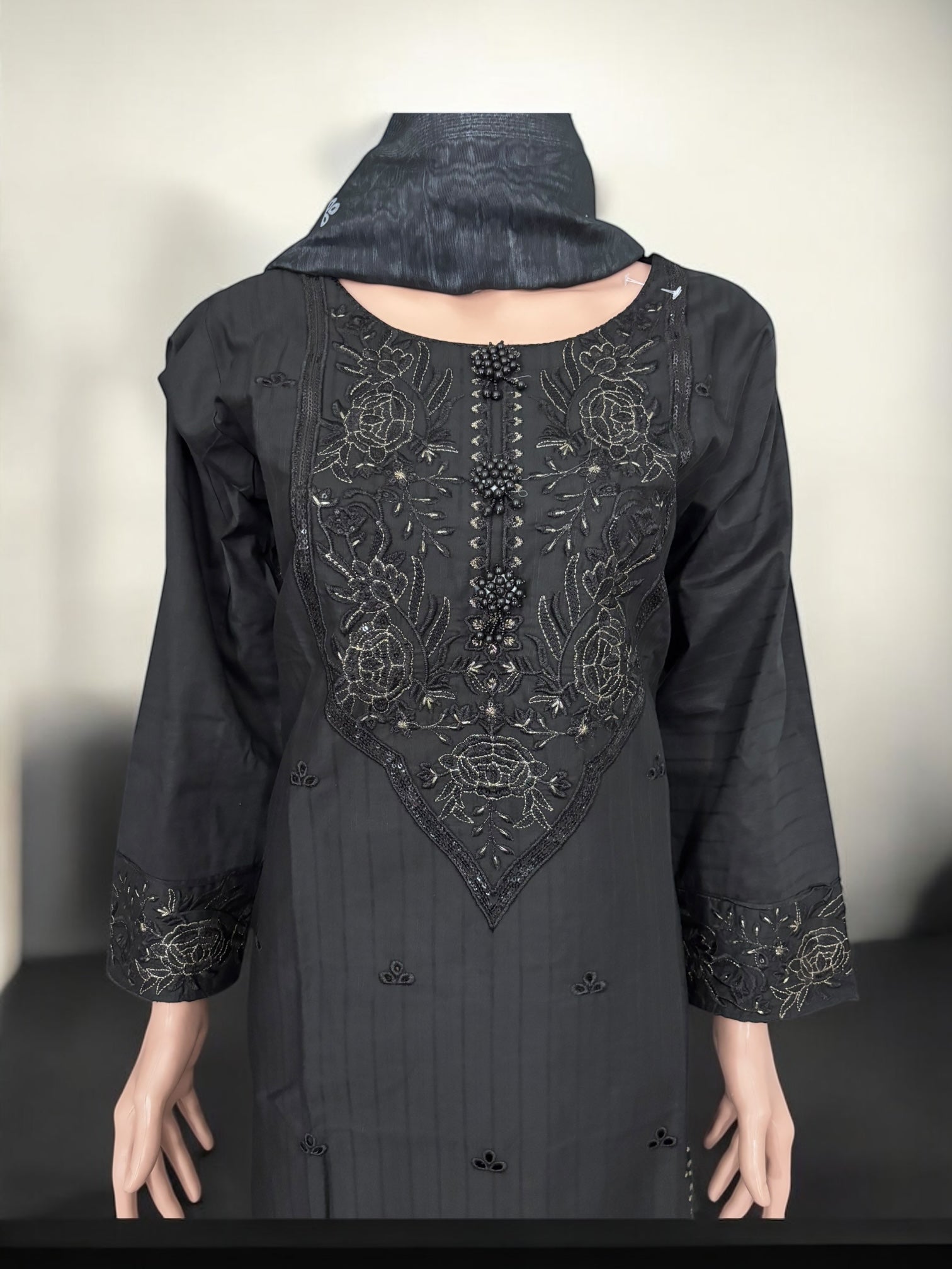 Traditional Pakistani Salwar Kameez by Saree Ghor Charlotte, showcasing vibrant ethnic wear for women with intricate details.