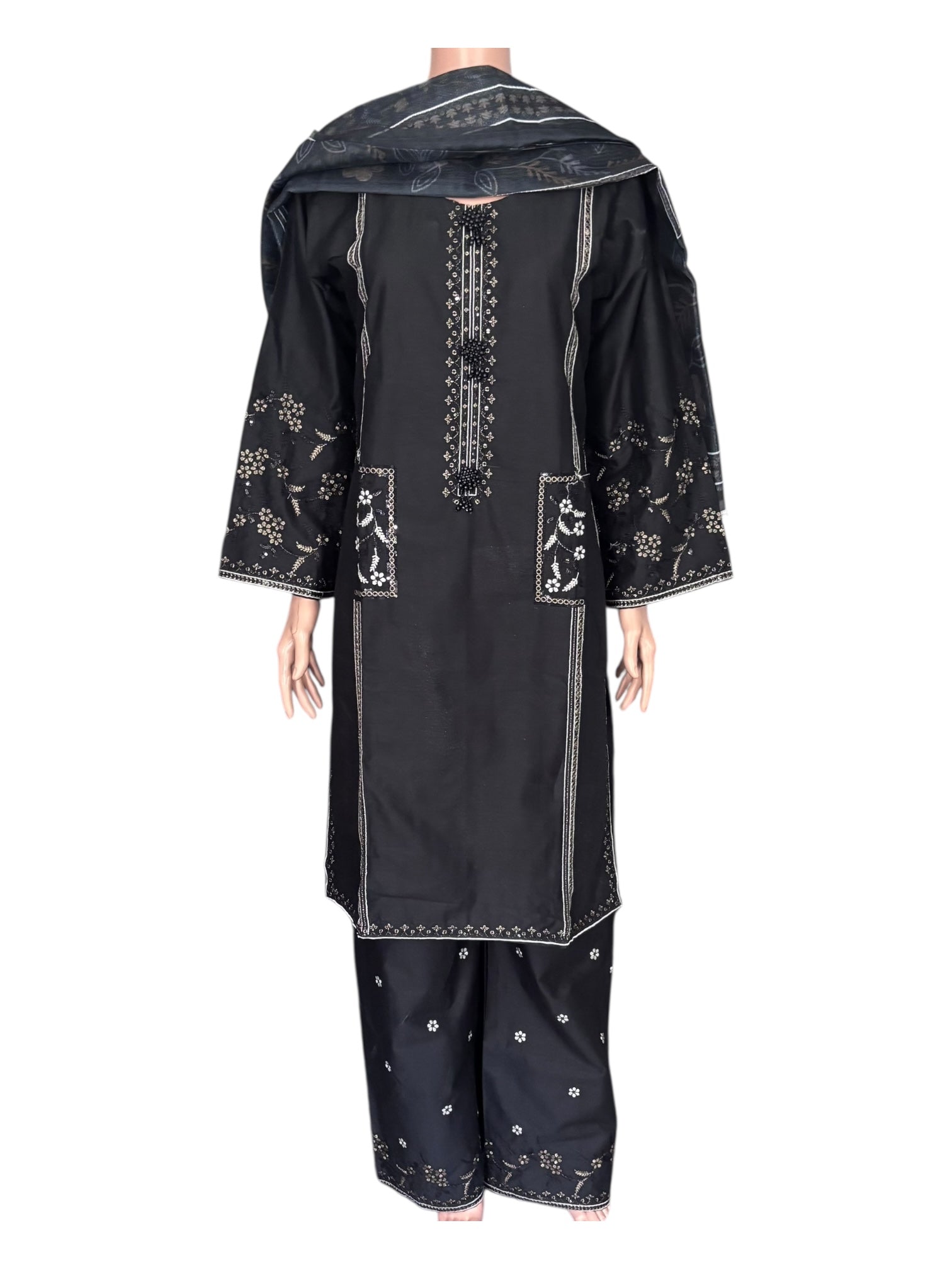 Traditional Pakistani Salwar Kameez by Saree Ghor Charlotte, vibrant ethnic wear for women with intricate embroidery.
