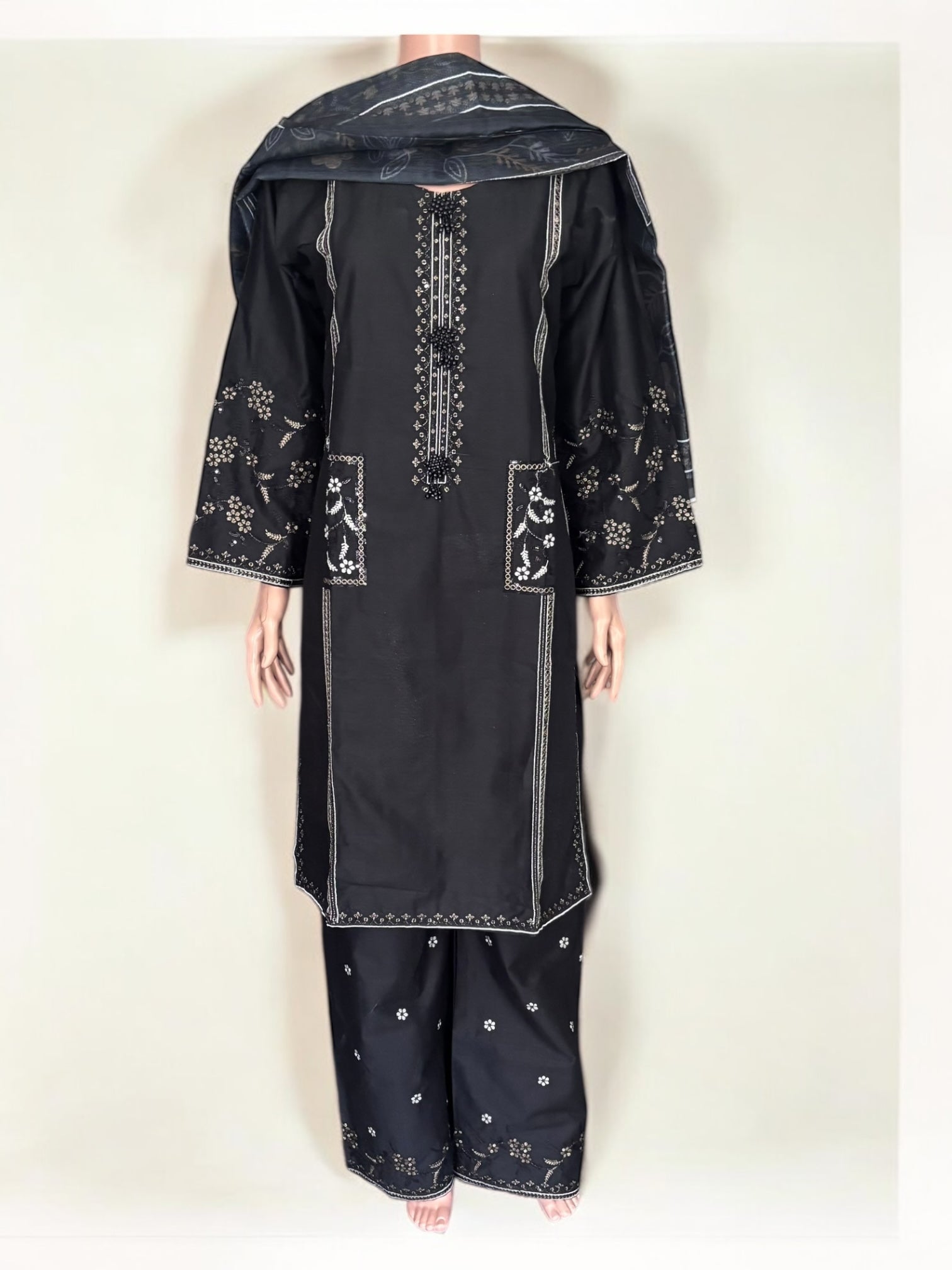 Traditional Pakistani Salwar Kameez by Saree Ghor Charlotte, showcasing intricate embroidery and vibrant ethnic wear for women.