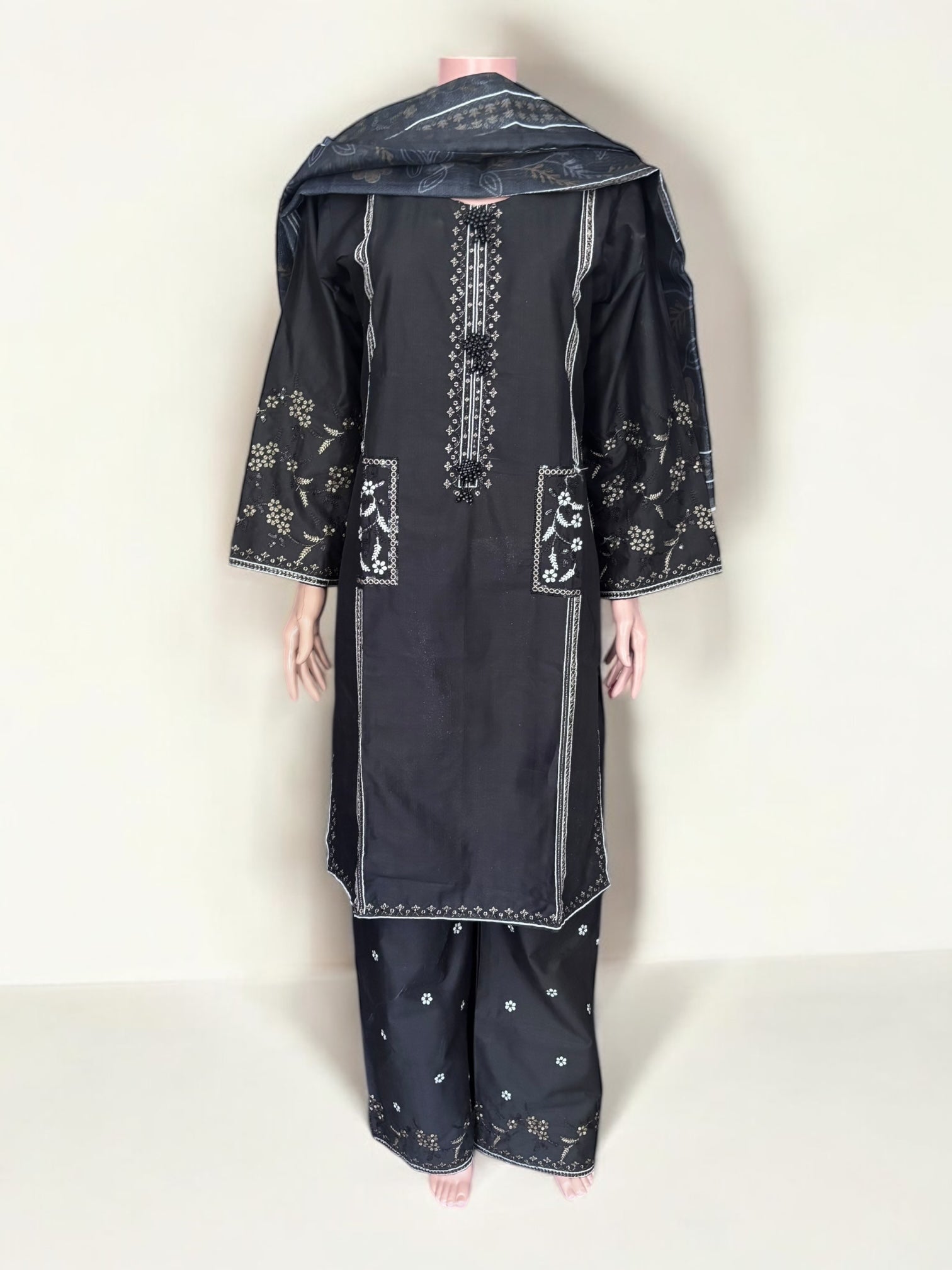 Traditional Pakistani Salwar Kameez by Saree Ghor Charlotte, featuring vibrant ethnic wear for women with intricate patterns.