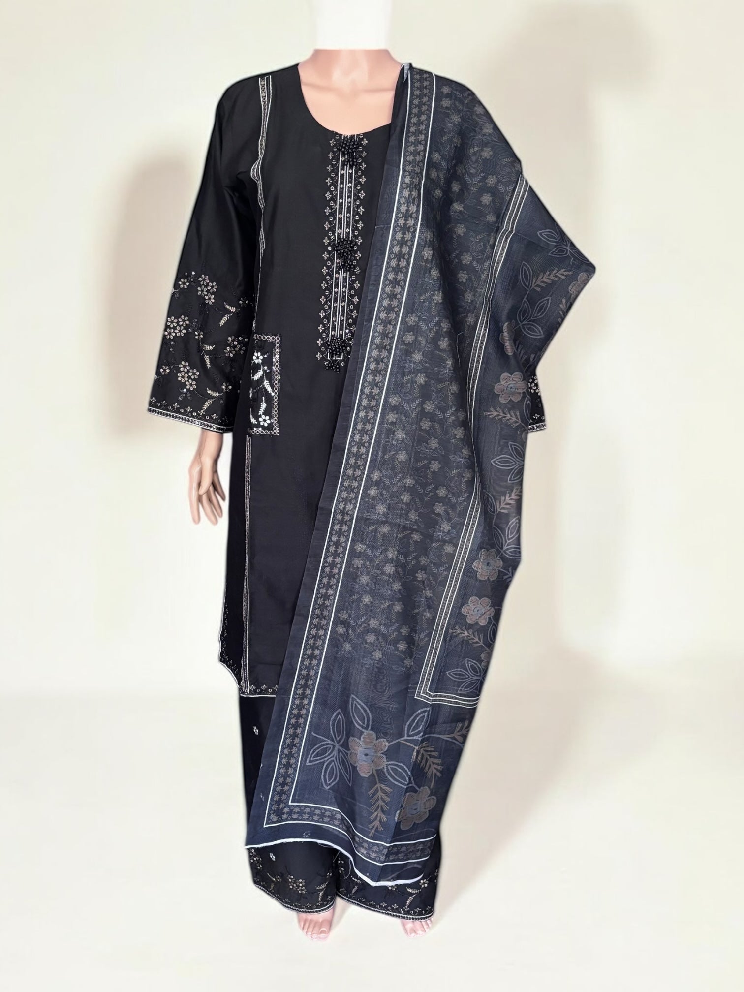 Traditional Pakistani Salwar Kameez by Saree Ghor Charlotte, featuring vibrant ethnic wear for women with intricate design details.