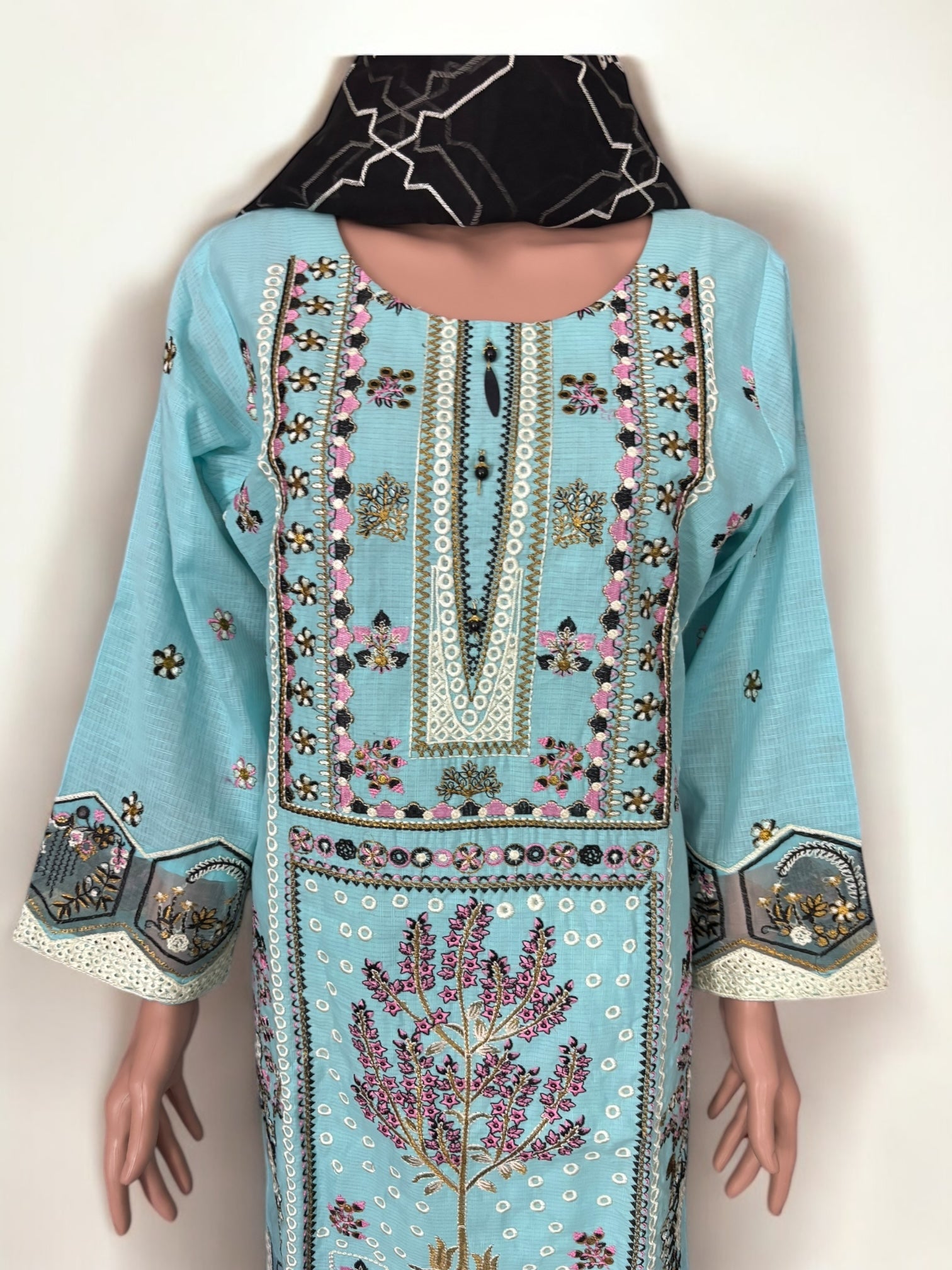 Traditional Pakistani Salwar Kameez by Saree Ghor Charlotte, ethnic wear for women, featuring intricate fabric and vibrant design.