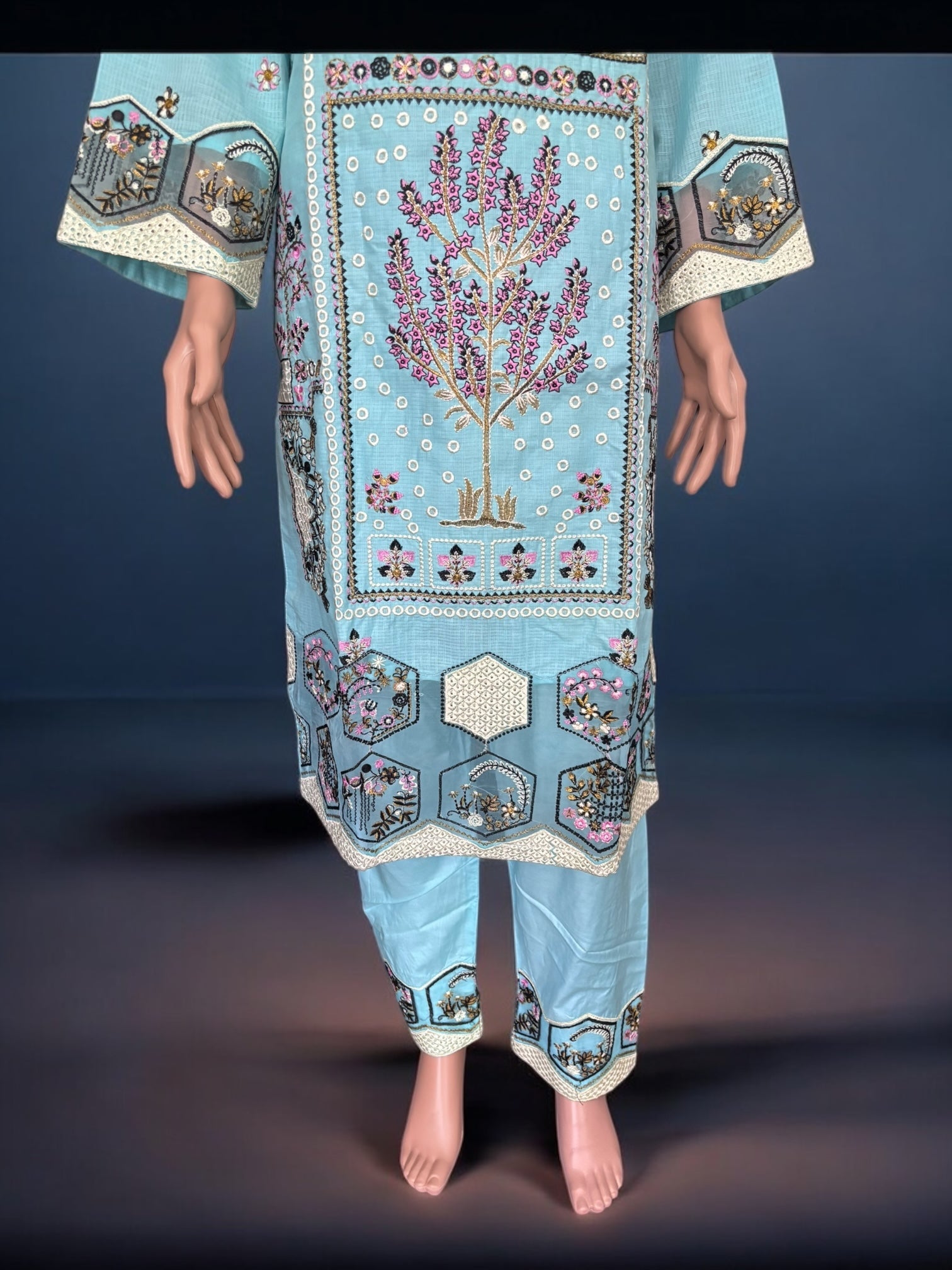 Traditional Pakistani Salwar Kameez by Saree Ghor Charlotte, featuring intricate embroidery and vibrant ethnic wear for women.