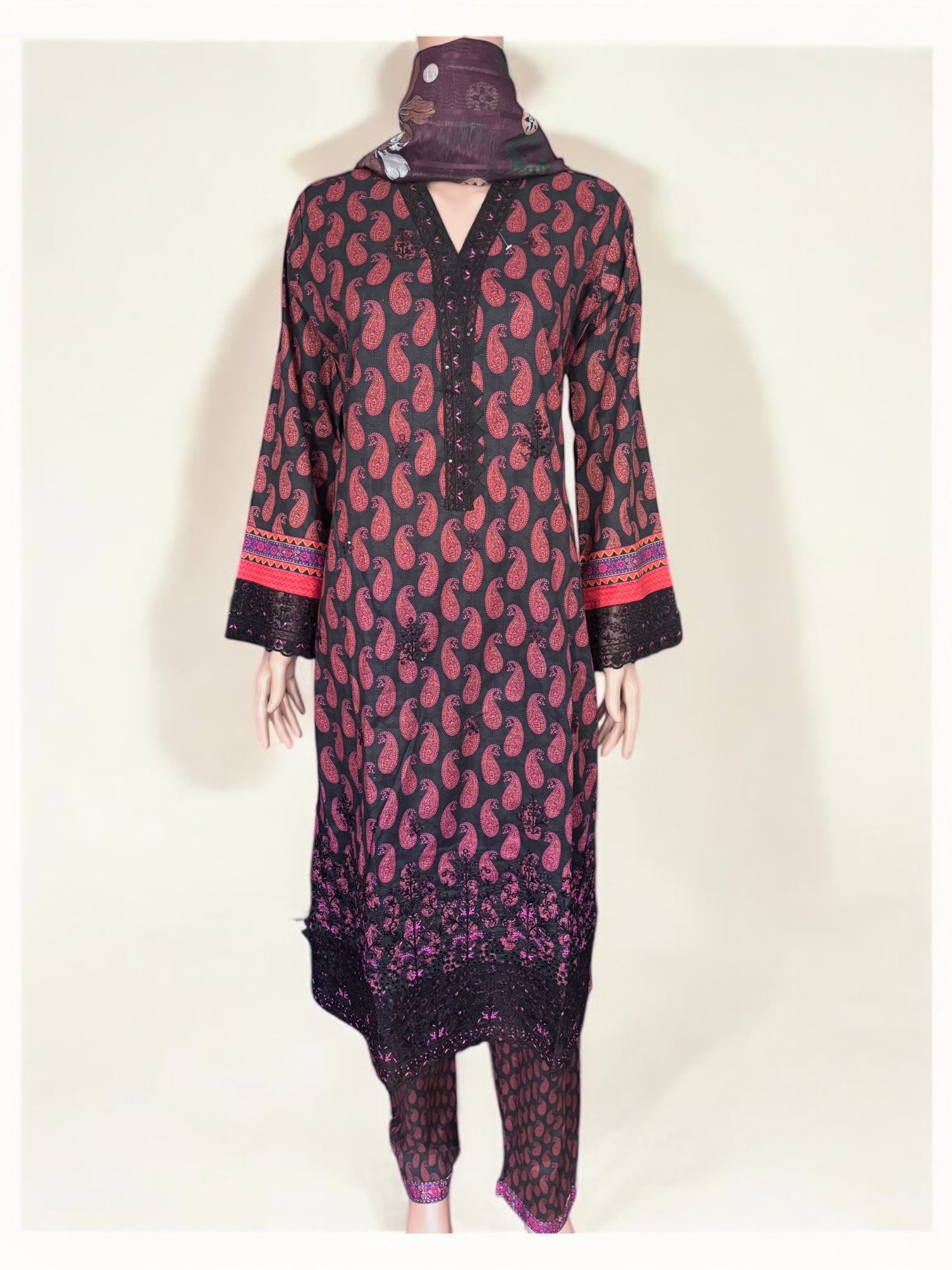 Traditional Pakistani Salwar Kameez by Saree Ghor Charlotte, featuring vibrant ethnic wear for women with intricate patterns.