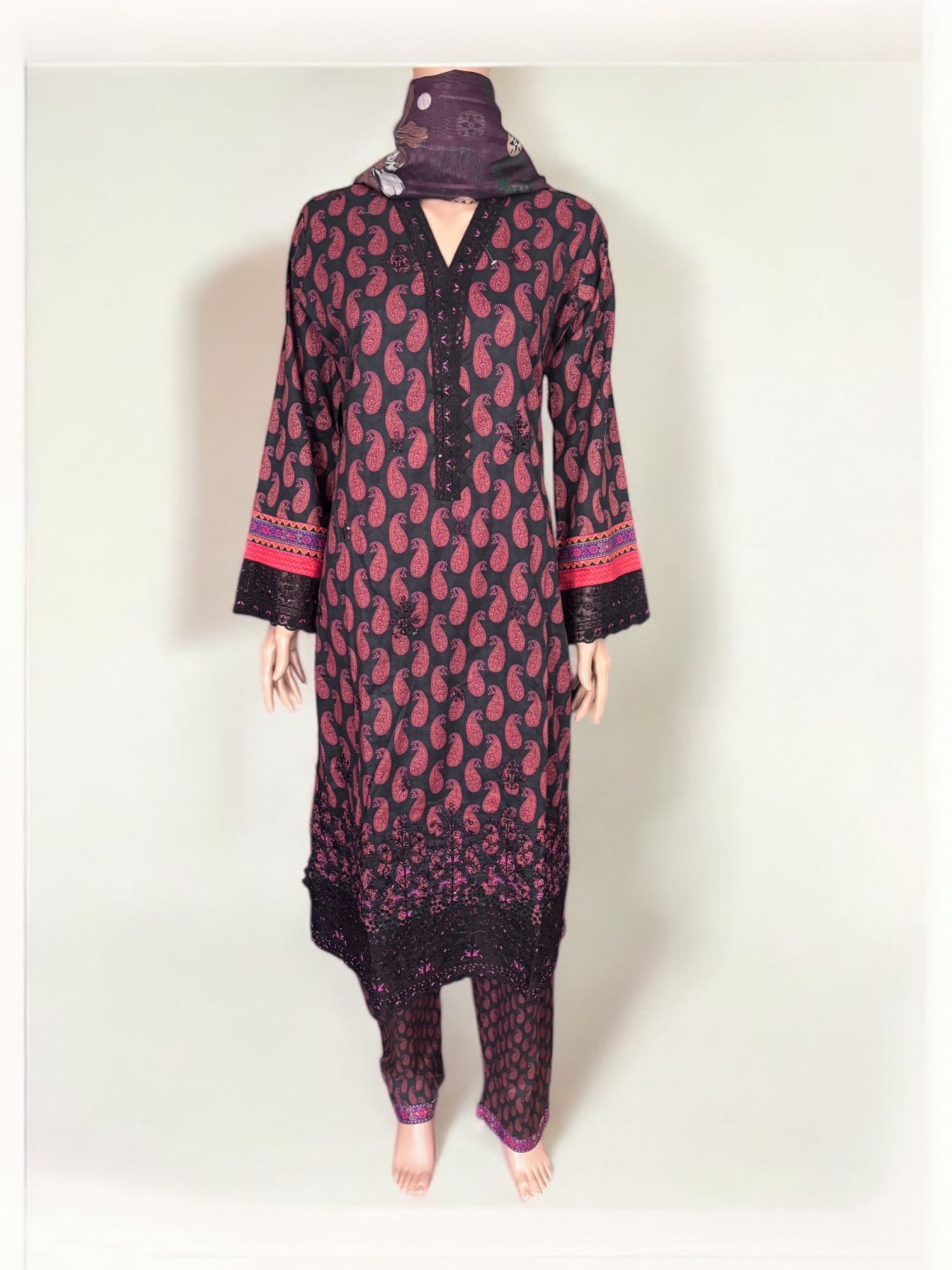 Traditional Pakistani Salwar Kameez by Saree Ghor Charlotte featuring vibrant ethnic wear for women with intricate embroidery.