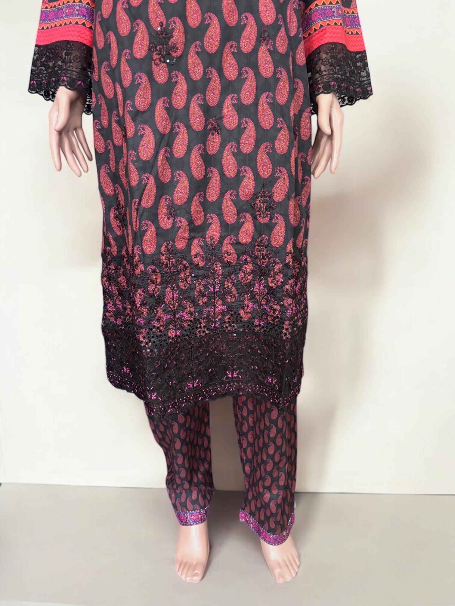 Traditional Pakistani Salwar Kameez by Saree Ghor Charlotte, featuring vibrant ethnic wear for women with intricate design details.