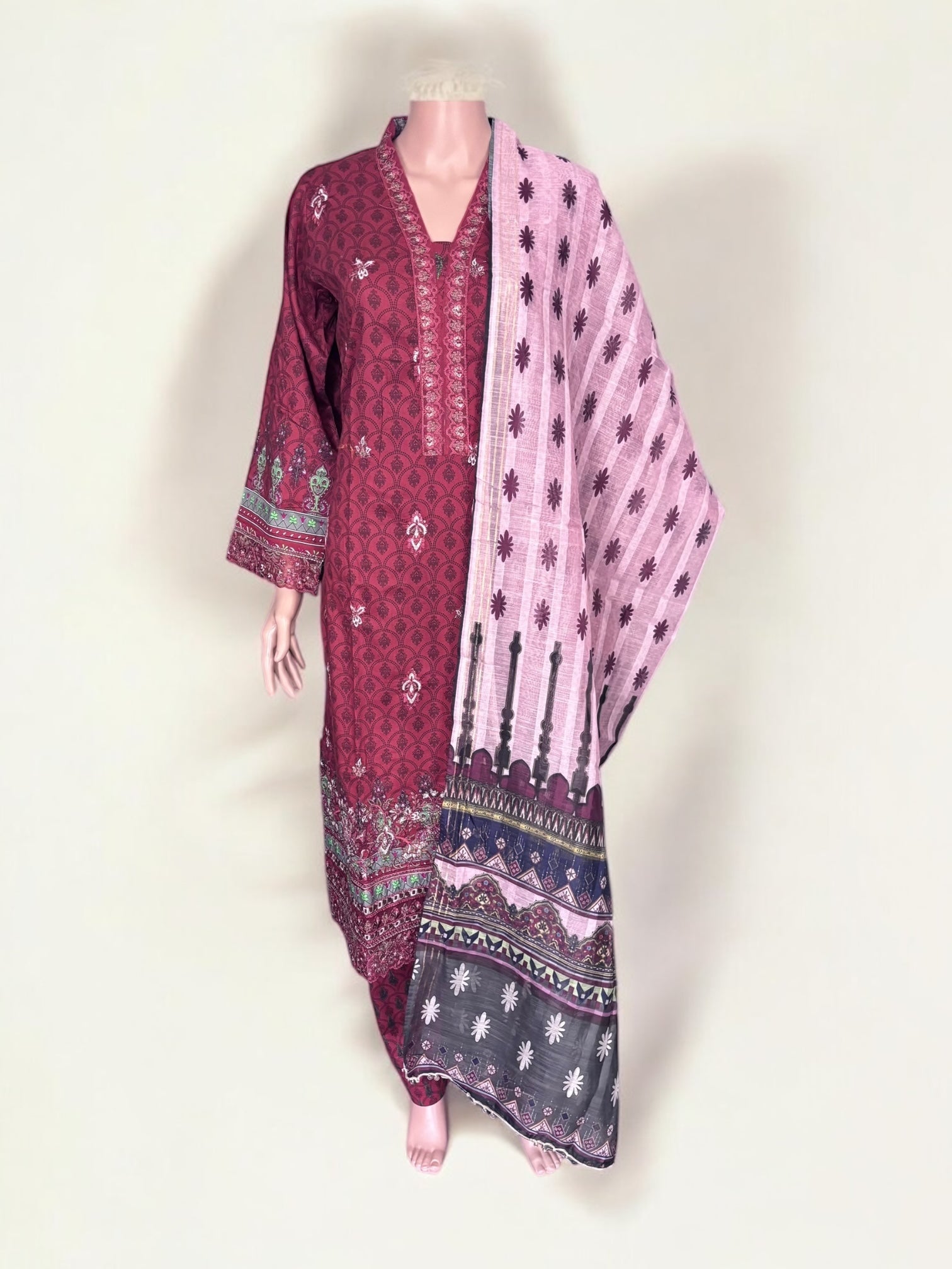 Traditional Pakistani Salwar Kameez by Saree Ghor Charlotte, showcasing vibrant ethnic wear for women with intricate patterns and fabric.