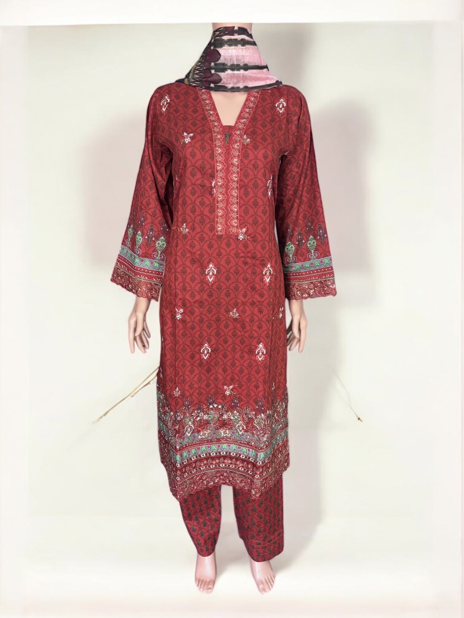 Traditional Pakistani Salwar Kameez by Saree Ghor Charlotte, featuring intricate embroidery and vibrant ethnic wear for women.