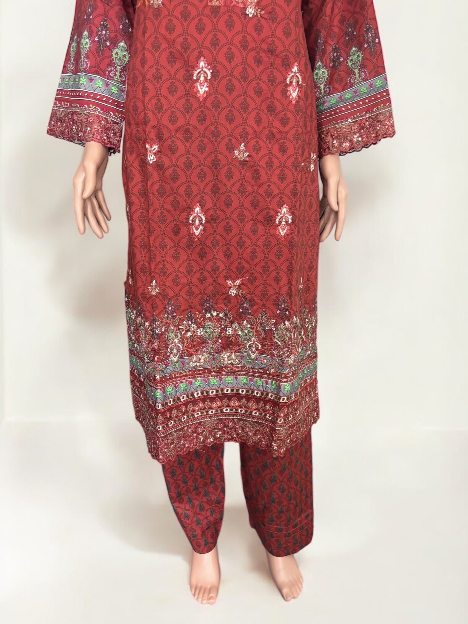 Traditional Pakistani Salwar Kameez by Saree Ghor Charlotte, elegant ethnic wear for women with intricate fabric details.
