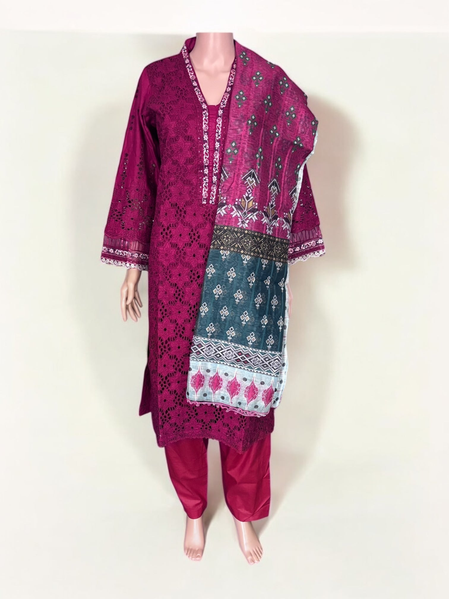 Traditional Pakistani Salwar Kameez by Saree Ghor Charlotte featuring vibrant ethnic wear for women with intricate embroidery and colorful fabric.