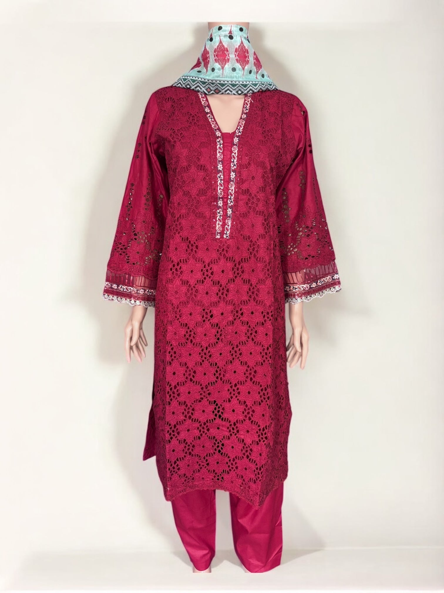 Traditional Pakistani Salwar Kameez by Saree Ghor Charlotte, showcasing intricate embroidery and vibrant ethnic wear for women.