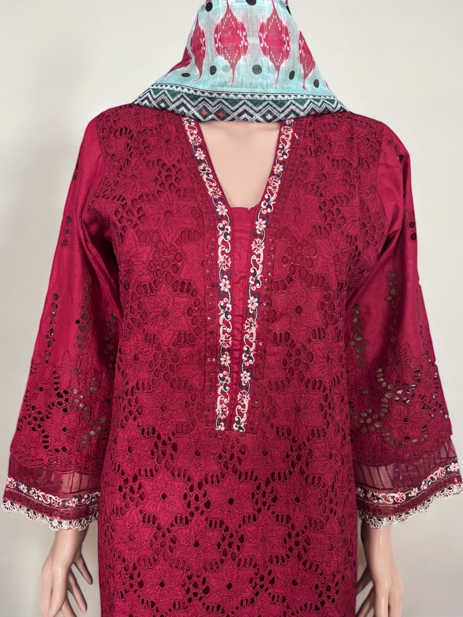 Traditional Pakistani Salwar Kameez by Saree Ghor Charlotte, elegant ethnic wear for women featuring intricate embroidery and vibrant fabric.