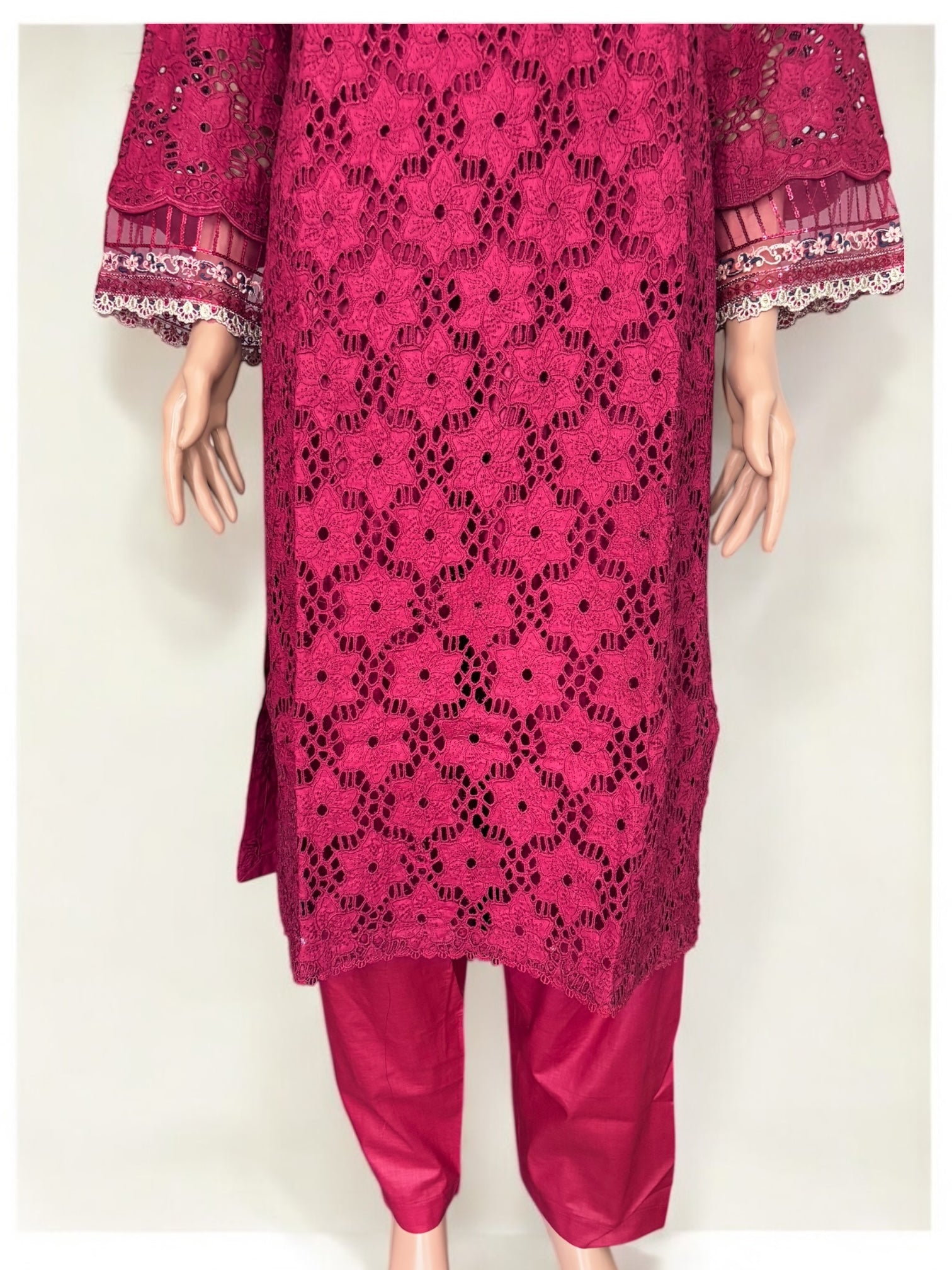 Traditional Pakistani Salwar Kameez by Saree Ghor Charlotte, featuring intricate embroidery and vibrant fabric for women.