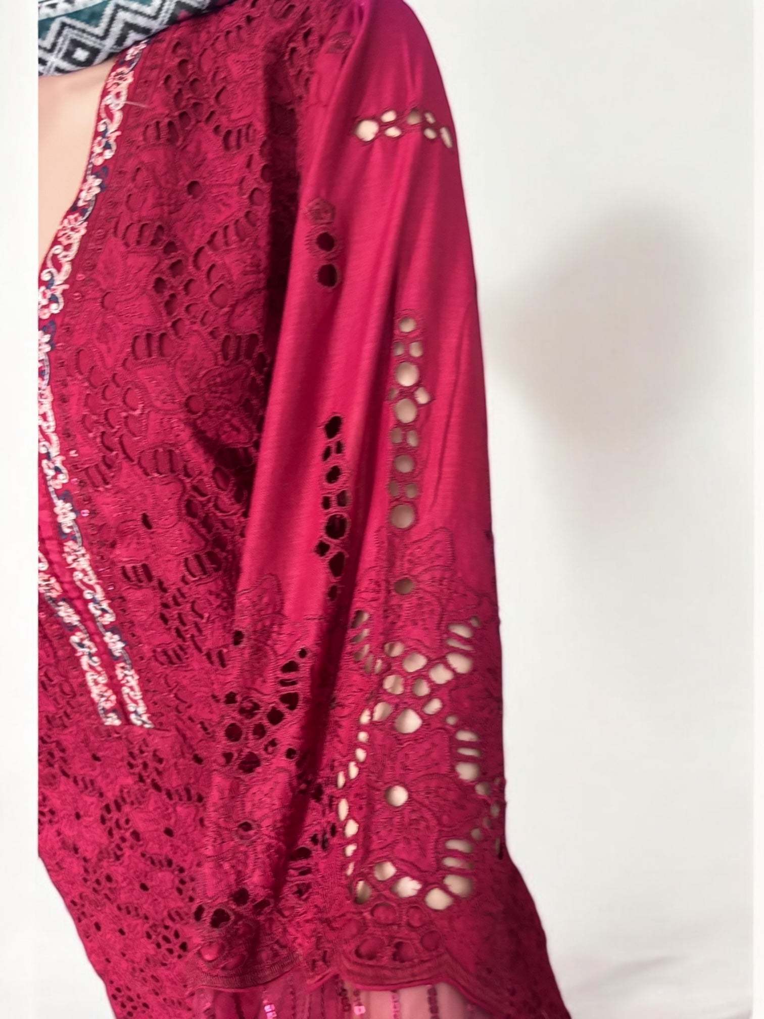 Traditional Pakistani Salwar Kameez by Saree Ghor Charlotte, elegant ethnic wear for women, featuring vibrant fabric and intricate embroidery.