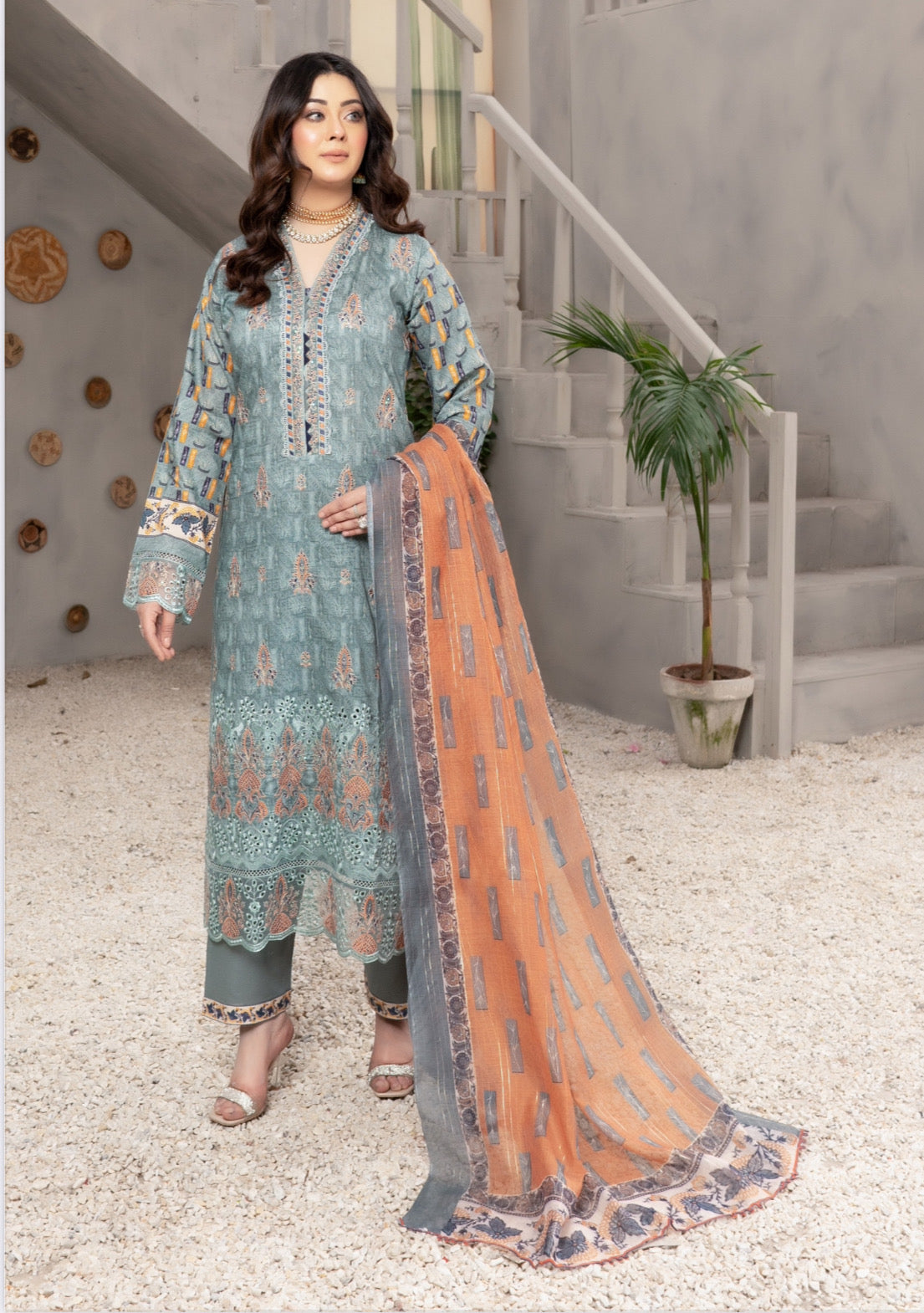 Traditional Pakistani Salwar Kameez by Saree Ghor Charlotte, ethnic wear for women with intricate embroidery and vibrant fabric.