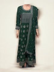Traditional party wear gown by Saree Ghor Charlotte, elegant ethnic salwar kameez for women, detailed fabric and design visible.