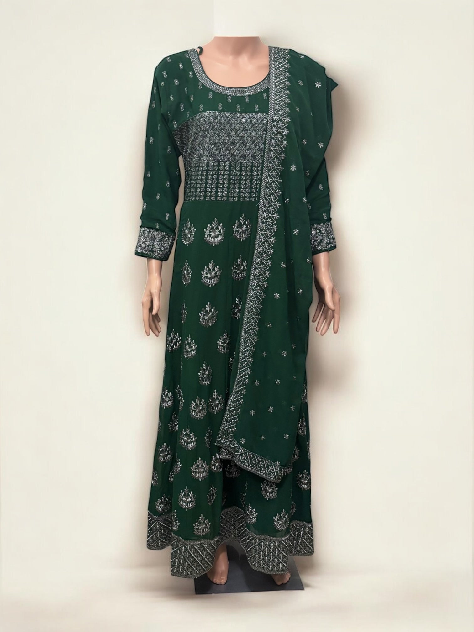Traditional party wear gown by Saree Ghor Charlotte, elegant ethnic salwar kameez for women, detailed fabric and design visible.