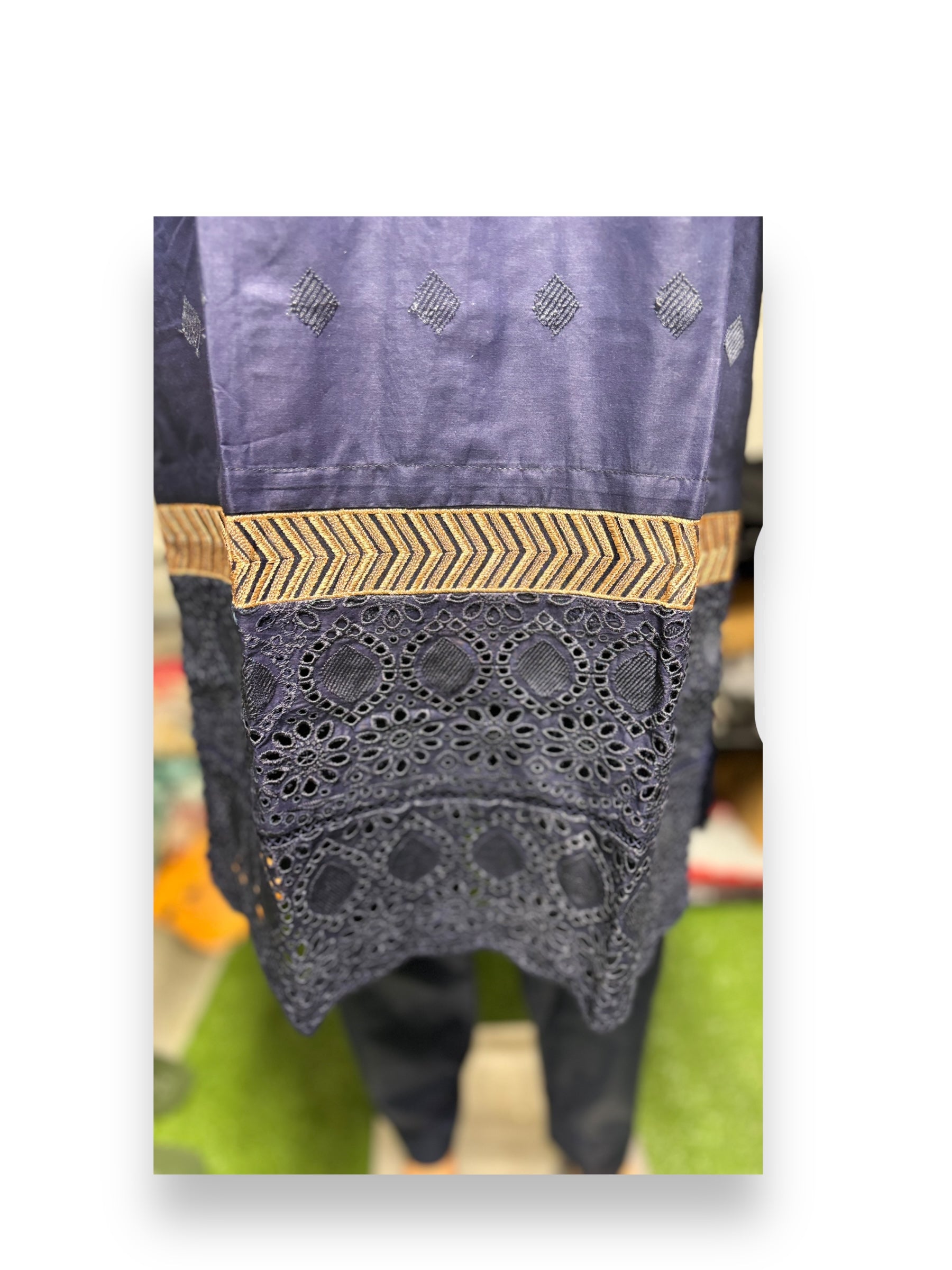 Traditional Salwar Kameez set by Saree Ghor Charlotte, elegant ethnic wear for women, featuring colorful fabric and intricate design.