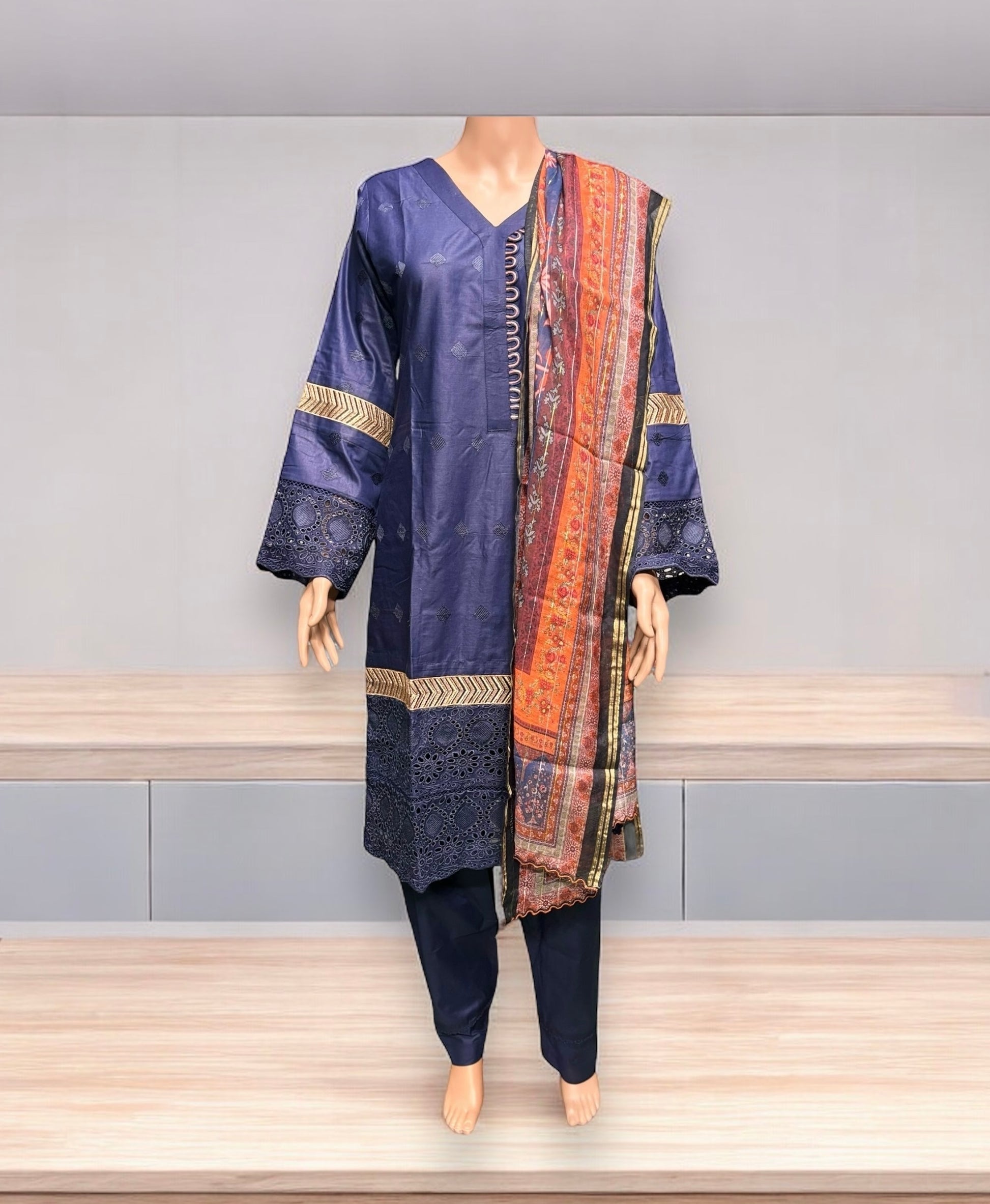 Traditional Salwar Kameez set by Saree Ghor Charlotte, ethnic wear for women featuring vibrant fabric and intricate design.