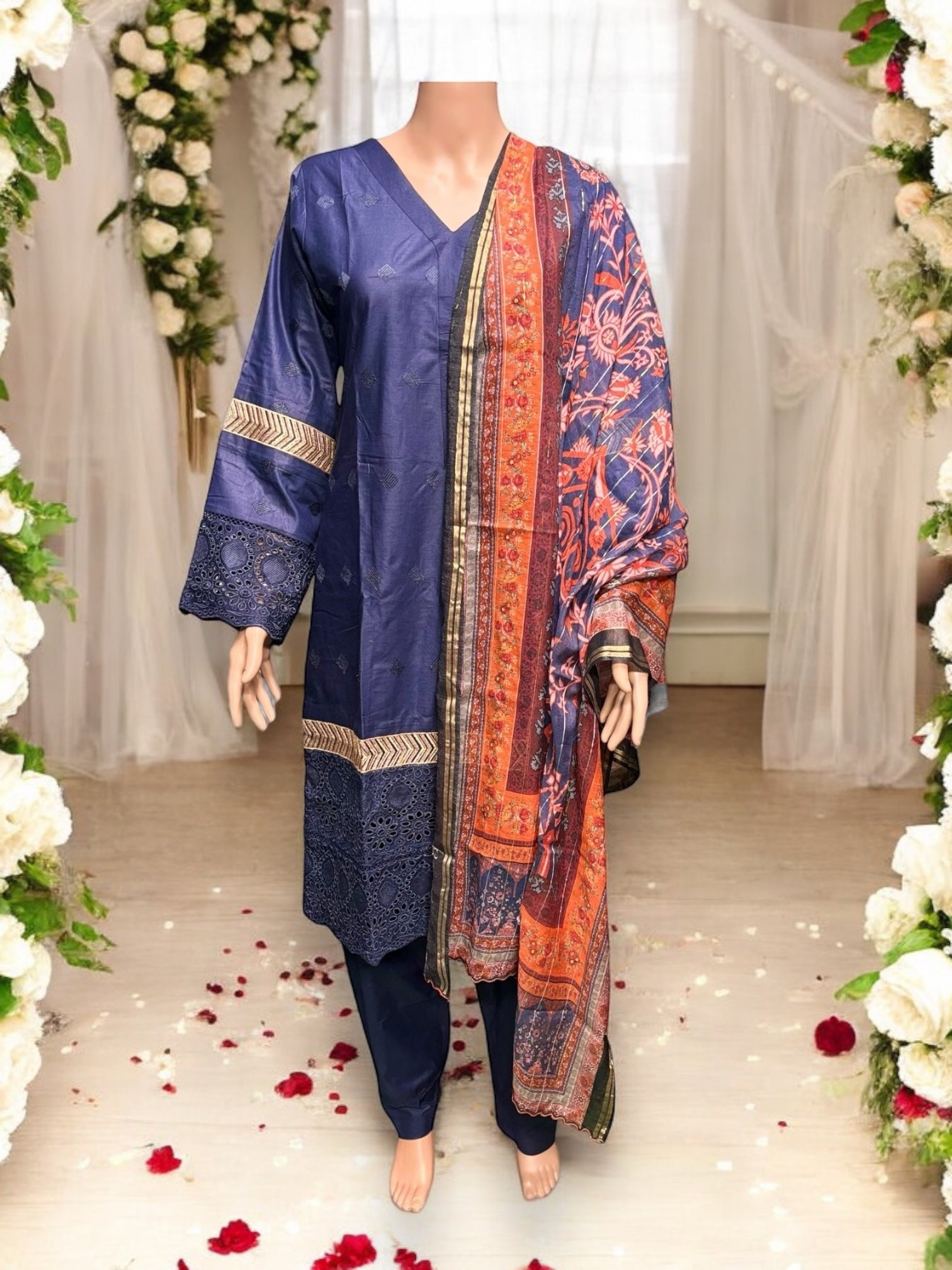 Traditional Salwar Kameez set by Saree Ghor Charlotte, featuring colorful ethnic wear for women with intricate designs.