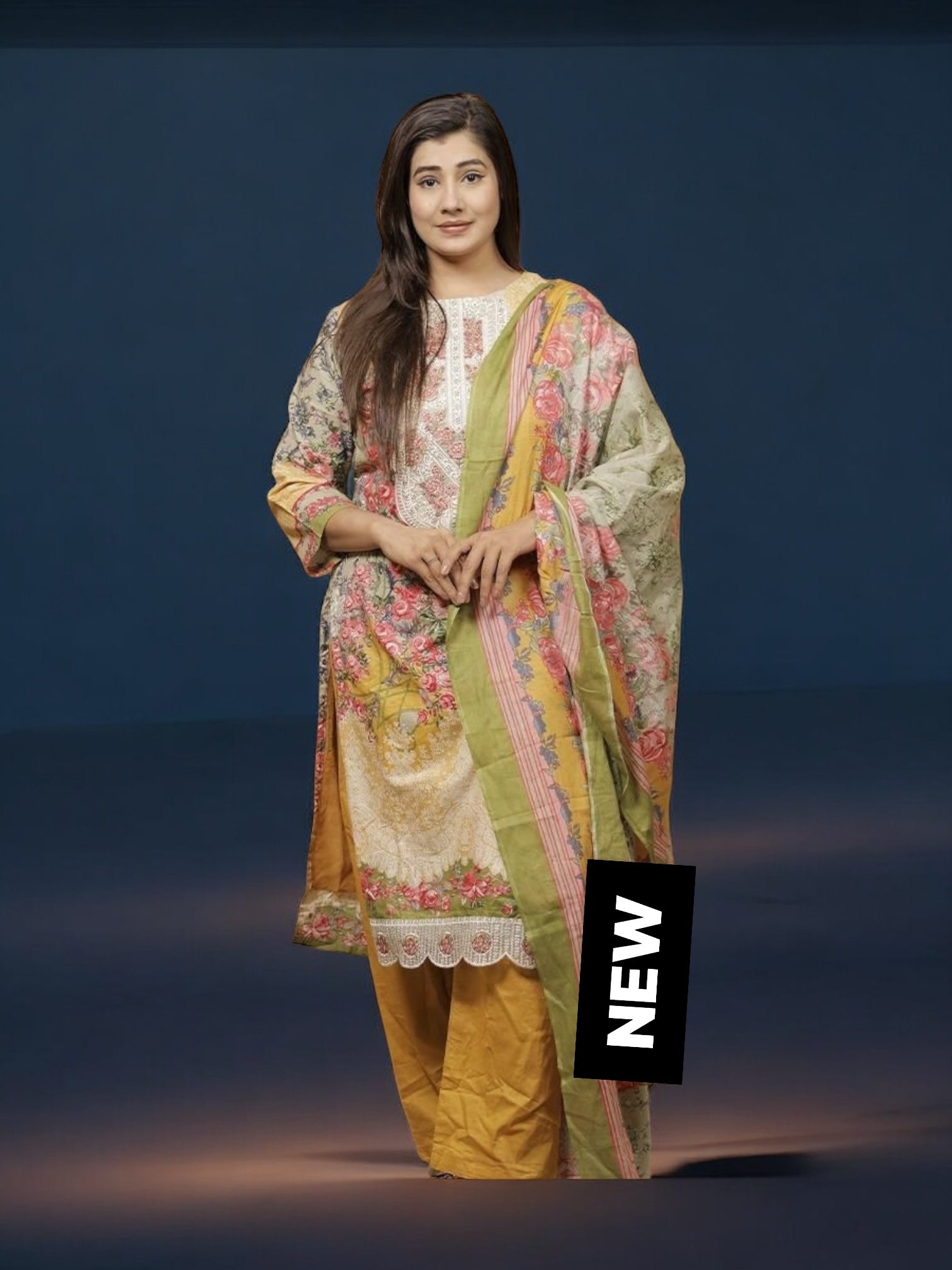 Traditional Salwar Kameez set by Saree Ghor Charlotte featuring vibrant ethnic wear for women, with intricate patterns and flowing fabric.
