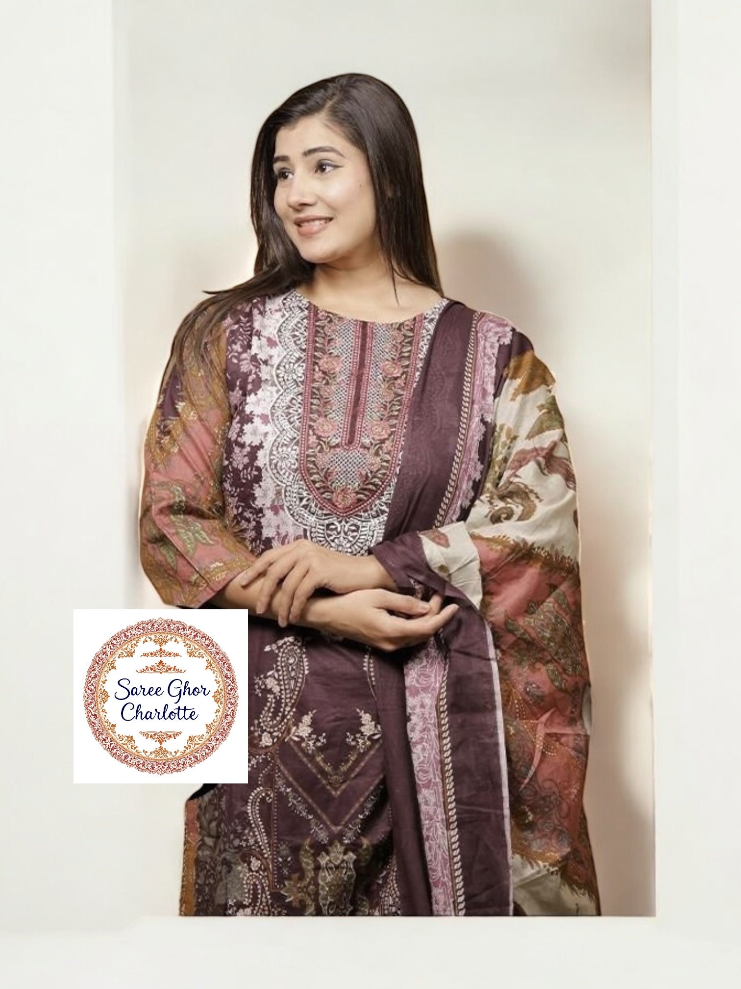 Traditional Salwar Kameez set by Saree Ghor Charlotte featuring a colorful ethnic dress for women, showcasing intricate patterns and fabric.