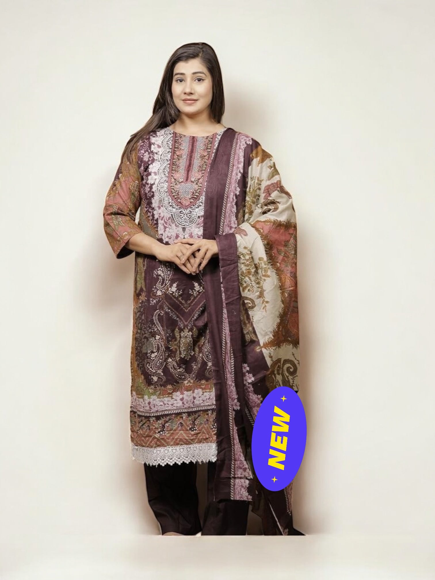 Traditional Salwar Kameez set by Saree Ghor Charlotte featuring intricate embroidery and vibrant ethnic wear for women.