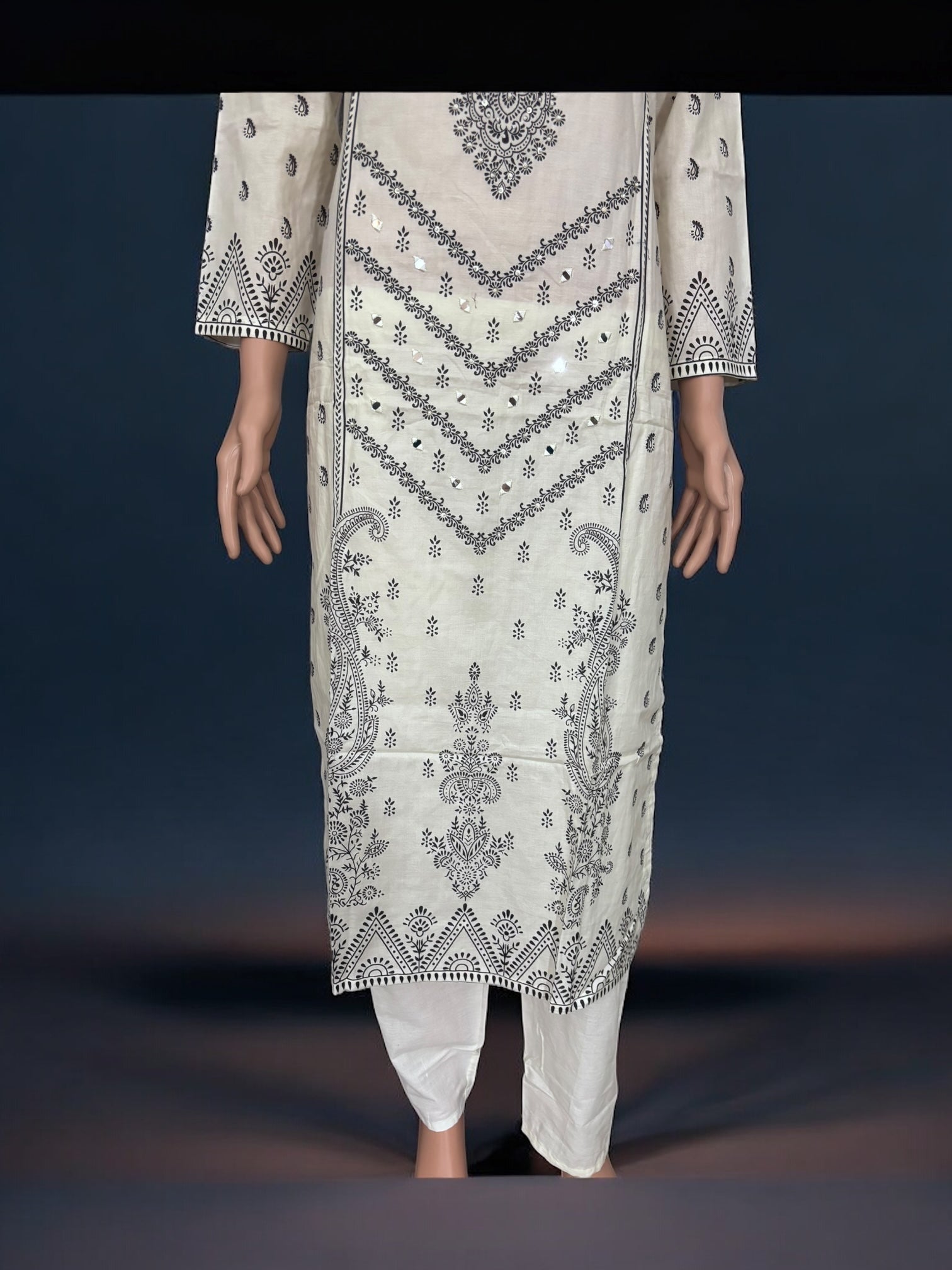Traditional Salwar Kameez set by Saree Ghor Charlotte with intricate embroidery, ethnic women's wear, vibrant fabric, and elegant styling.