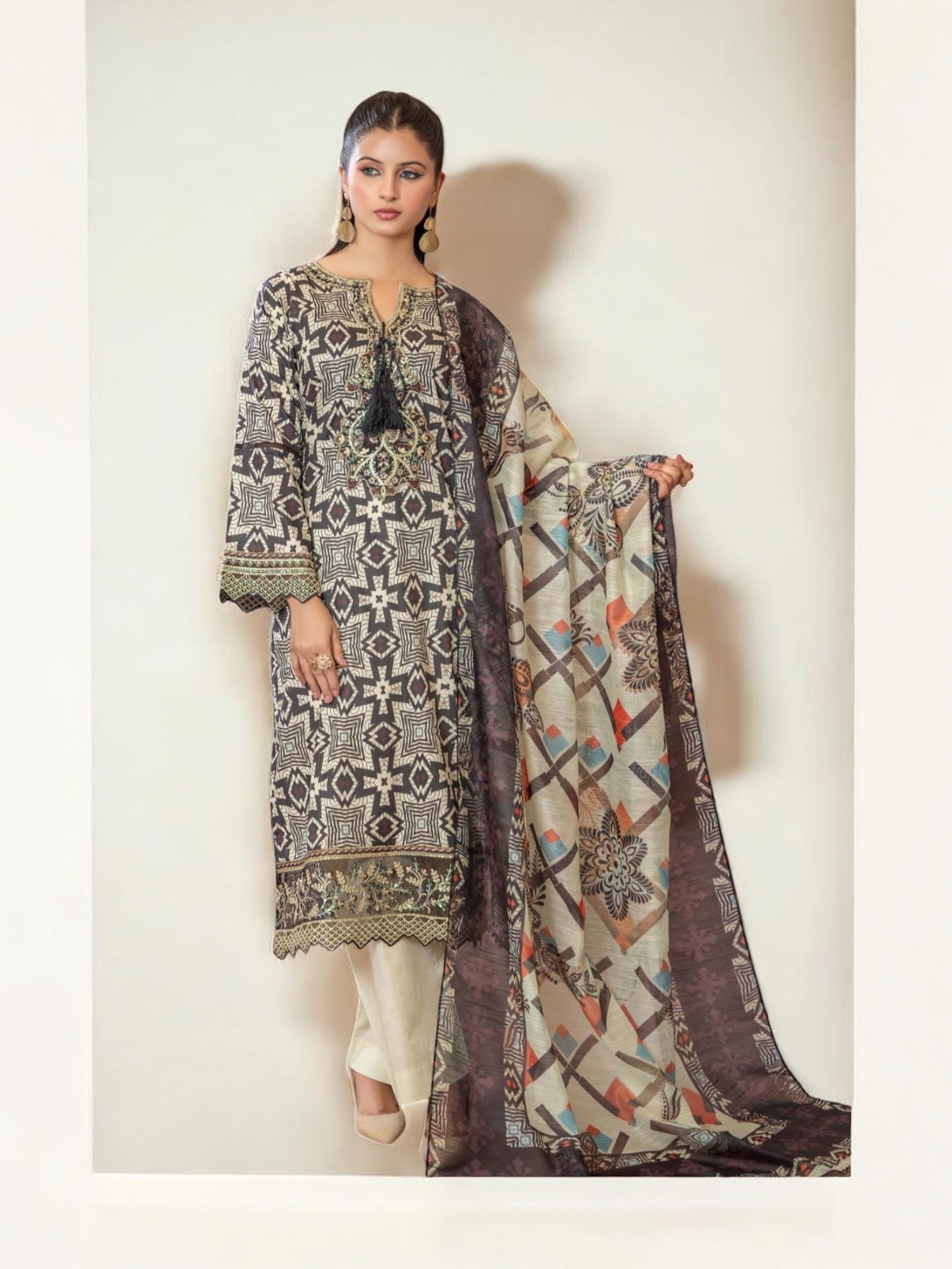 Pakistani Salwar Kameez set by Saree Ghor Charlotte, traditional ethnic wear for women with colorful fabric and intricate design.