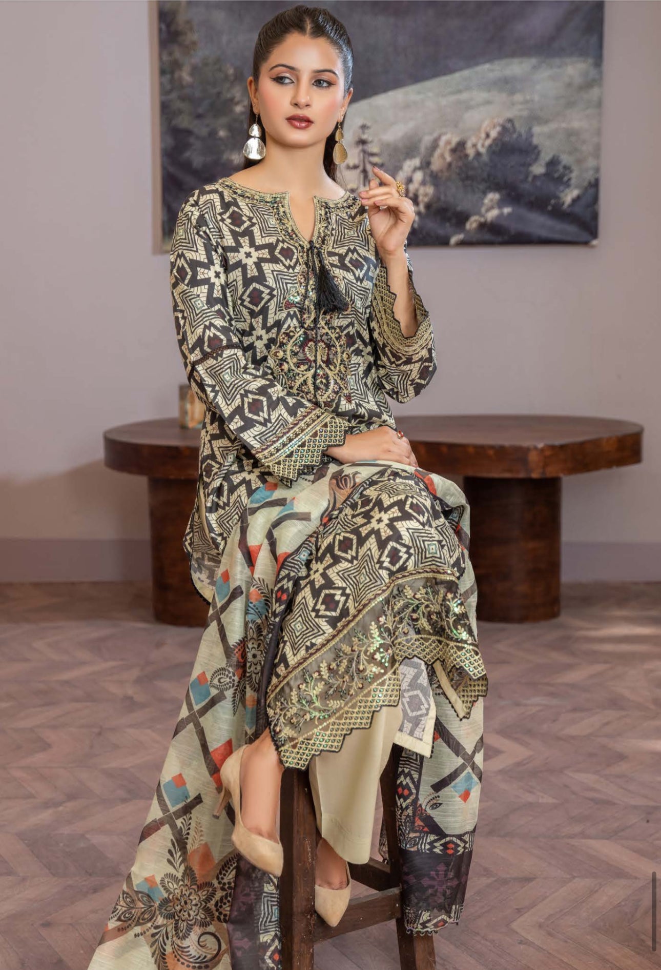 Pakistani Salwar Kameez set by Saree Ghor Charlotte, traditional ethnic wear for women featuring colorful kameez and matching salwar.
