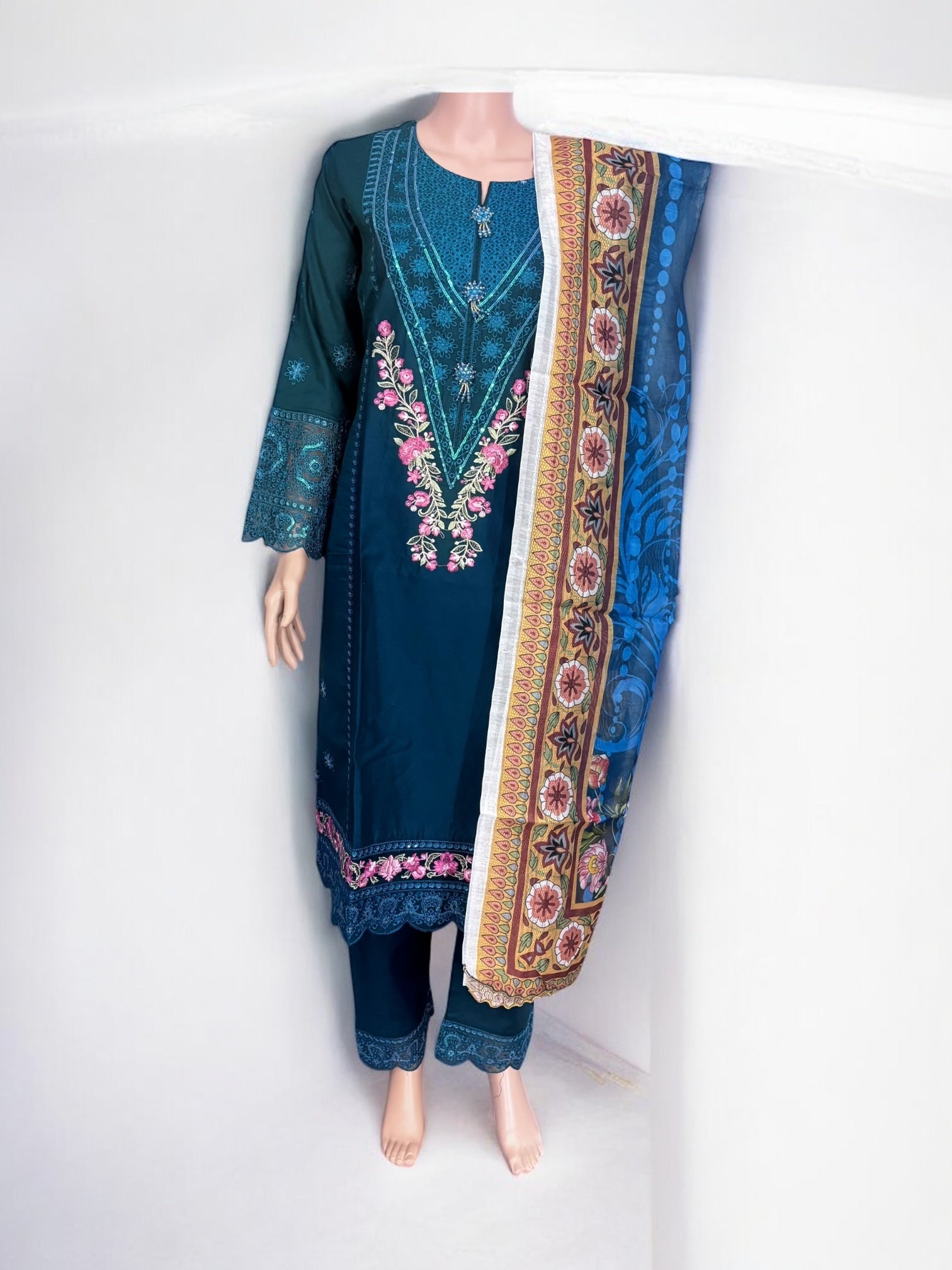 Traditional Salwar Kameez set by Saree Ghor Charlotte featuring intricate design, ethnic wear for women, perfect for cultural occasions.
