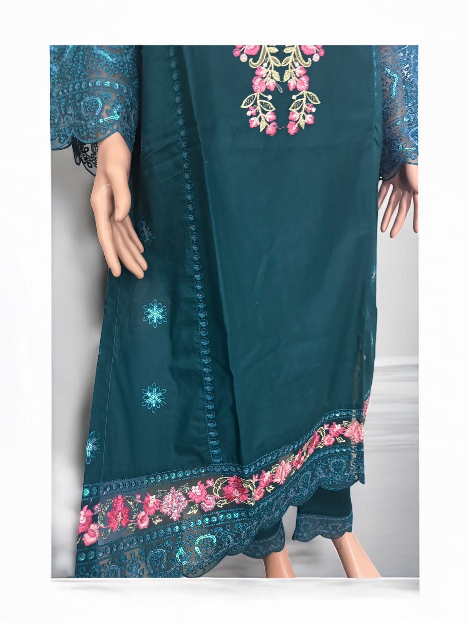 Traditional Salwar Kameez set by Saree Ghor Charlotte, featuring vibrant ethnic wear for women with detailed embroidery.