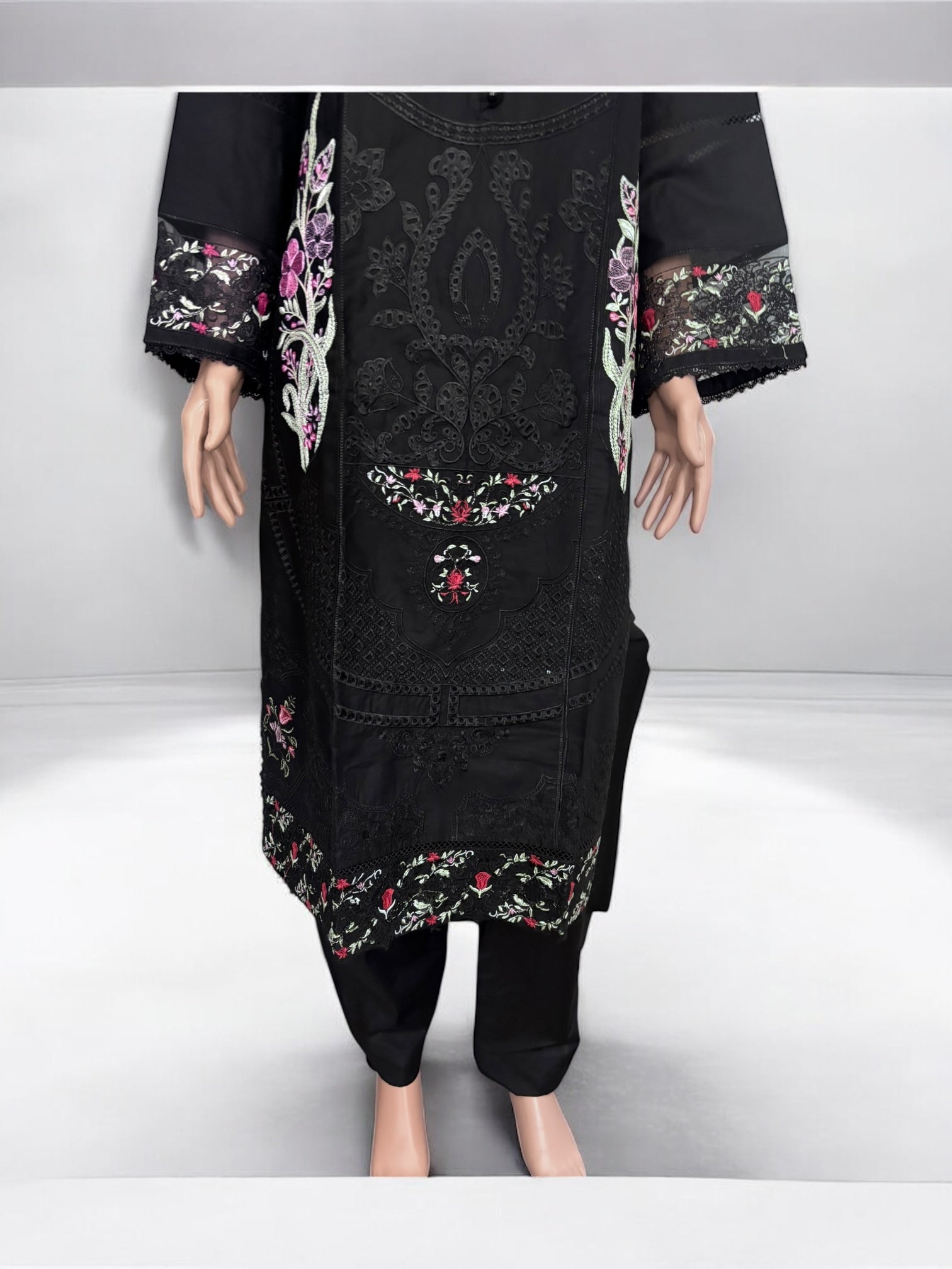 Traditional Salwar Kameez set by Saree Ghor Charlotte, ethnic women's wear with embroidered top and matching salwar trousers.