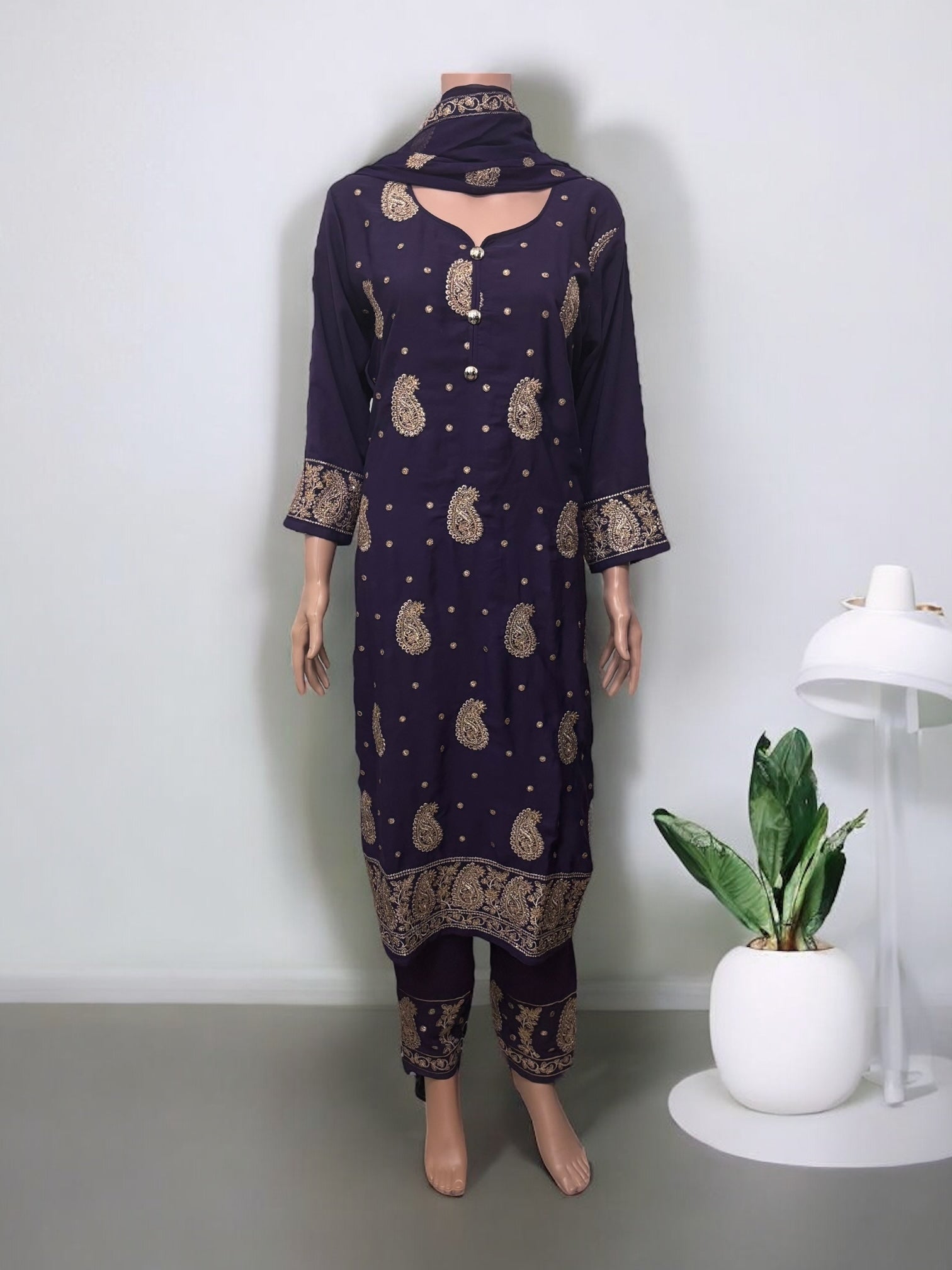 Traditional Saree Ghor Charlotte Salwar Kameez set with intricate ethnic design for women, showcasing vibrant fabric and detailed embroidery.