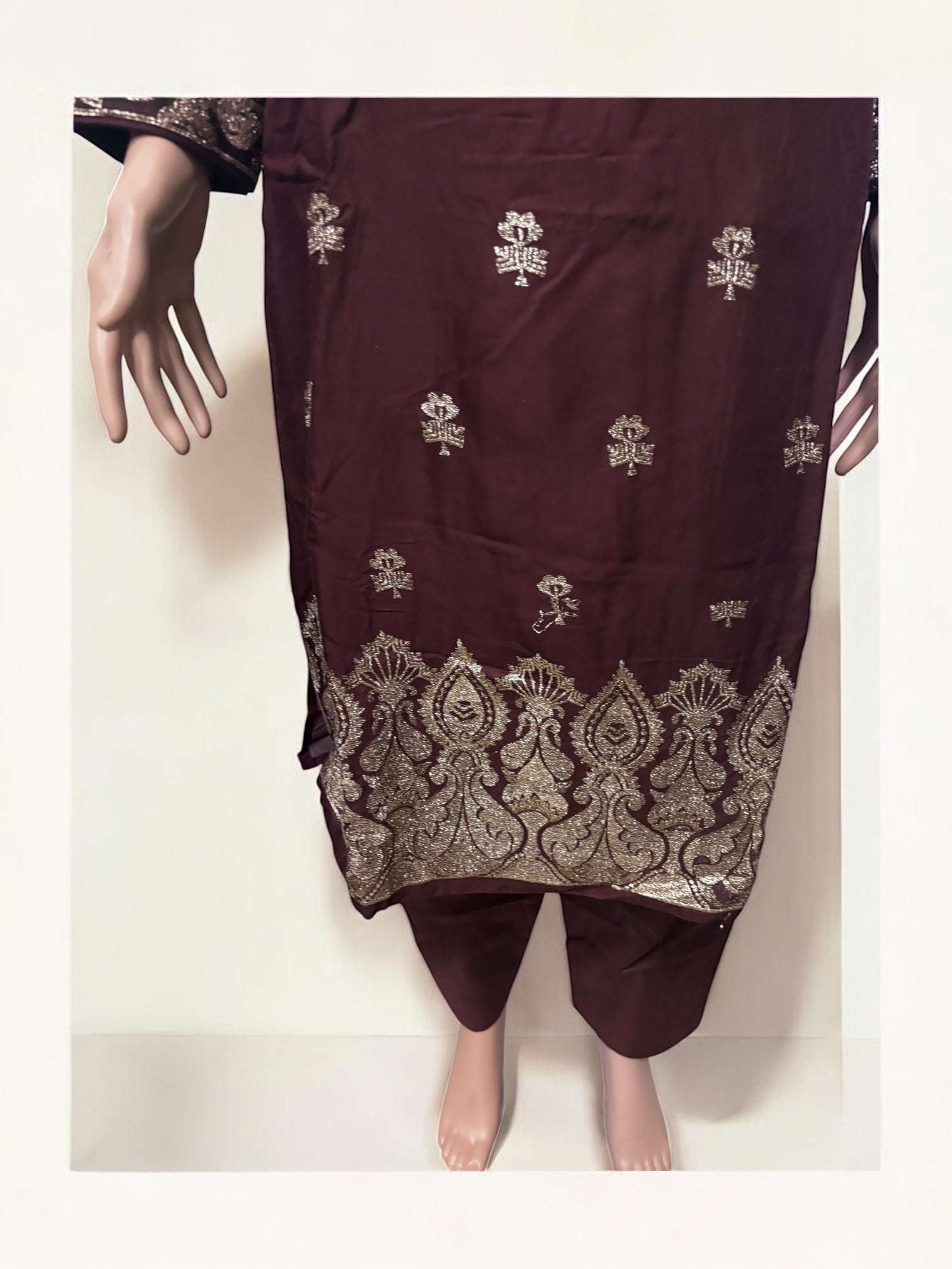 Traditional Salwar Kameez set by Saree Ghor Charlotte, women’s ethnic wear with intricate design and vibrant fabric details.