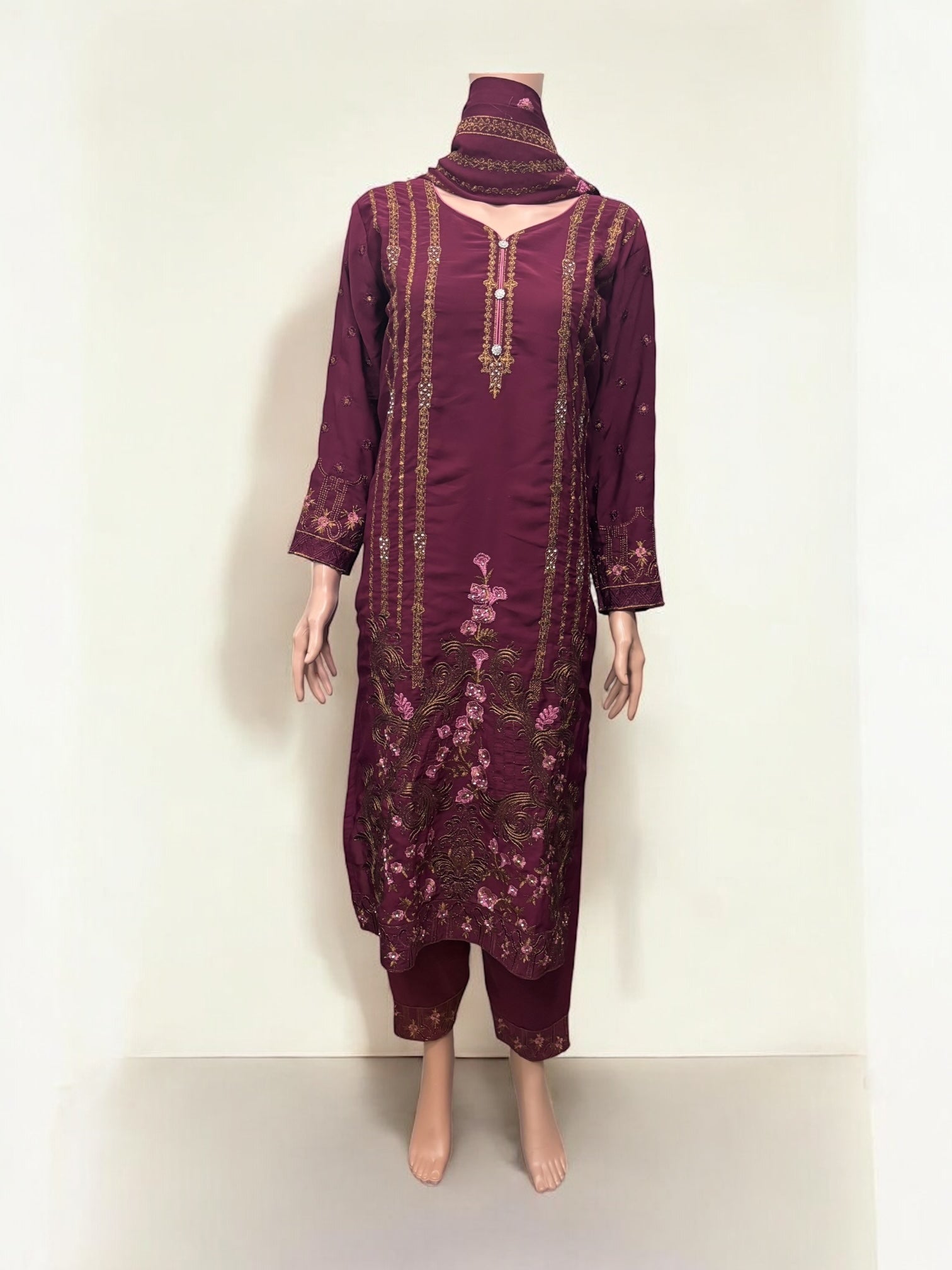 Traditional Salwar Kameez set by Saree Ghor Charlotte, ethnic wear for women featuring vibrant fabric and intricate design details.