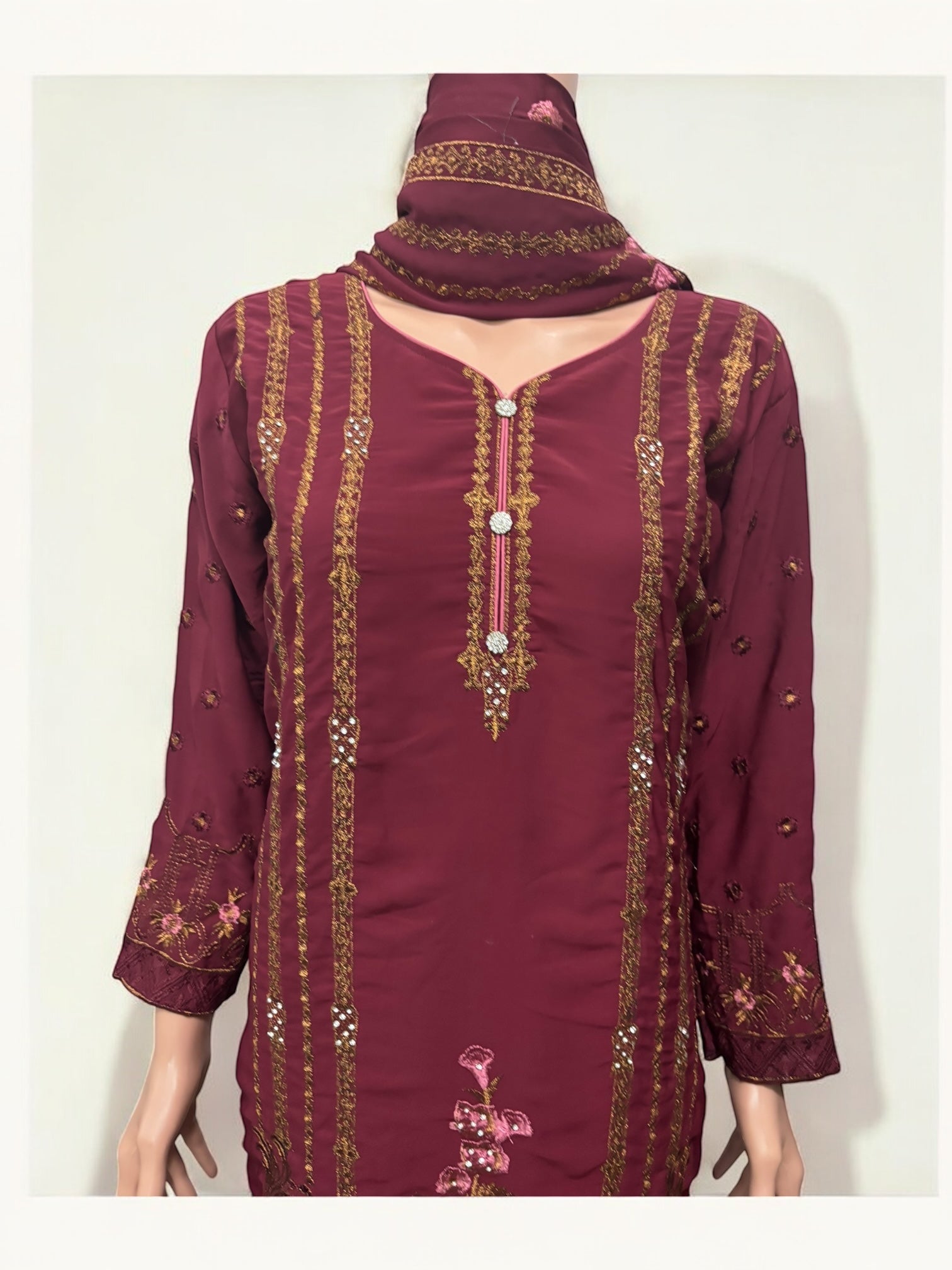 Traditional Salwar Kameez set by Saree Ghor Charlotte featuring ethnic wear for women with intricate embroidery and vibrant colors.