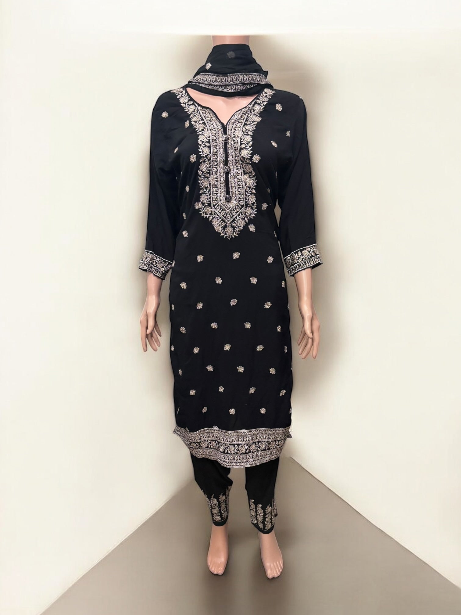 Traditional Salwar Kameez set by Saree Ghor Charlotte, ethnic wear for women featuring intricate designs and vibrant fabric.