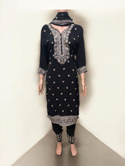 Traditional Salwar Kameez set by Saree Ghor Charlotte, ethnic wear for women featuring intricate designs and vibrant fabric.