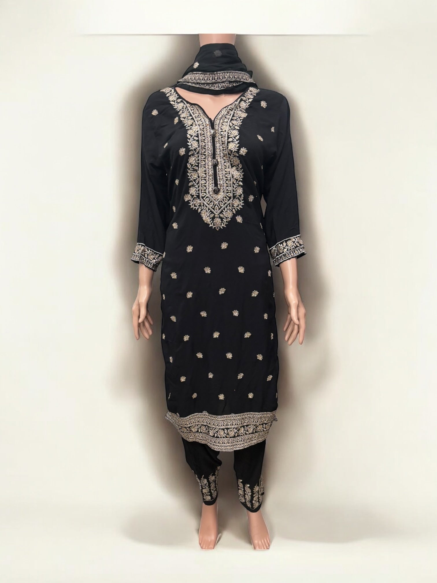 Traditional Salwar Kameez set by Saree Ghor Charlotte with intricate embroidery and vibrant colors, perfect for cultural wear for women.