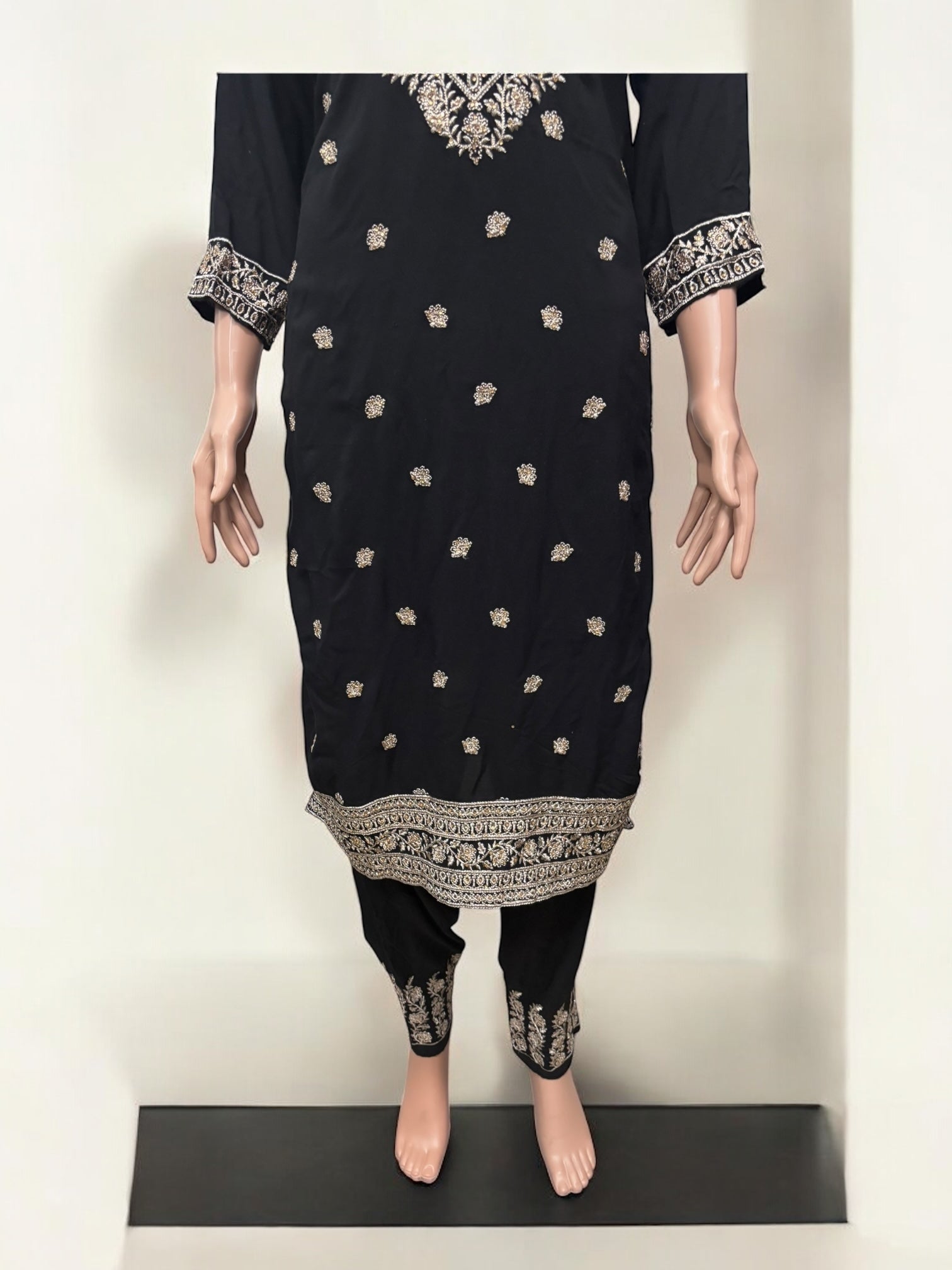 Traditional Salwar Kameez set by Saree Ghor Charlotte, ethnic women’s wear with vibrant fabric and intricate design.
