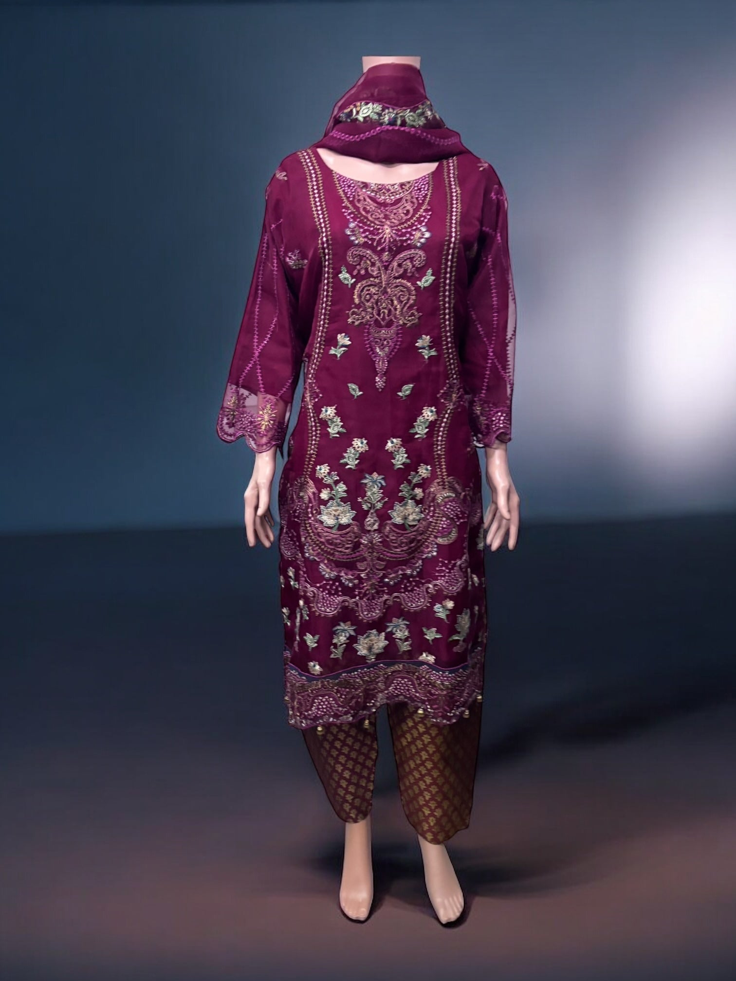 Traditional Salwar Kameez set by Saree Ghor Charlotte, ethnic women's wear with intricate design and vibrant fabric details.