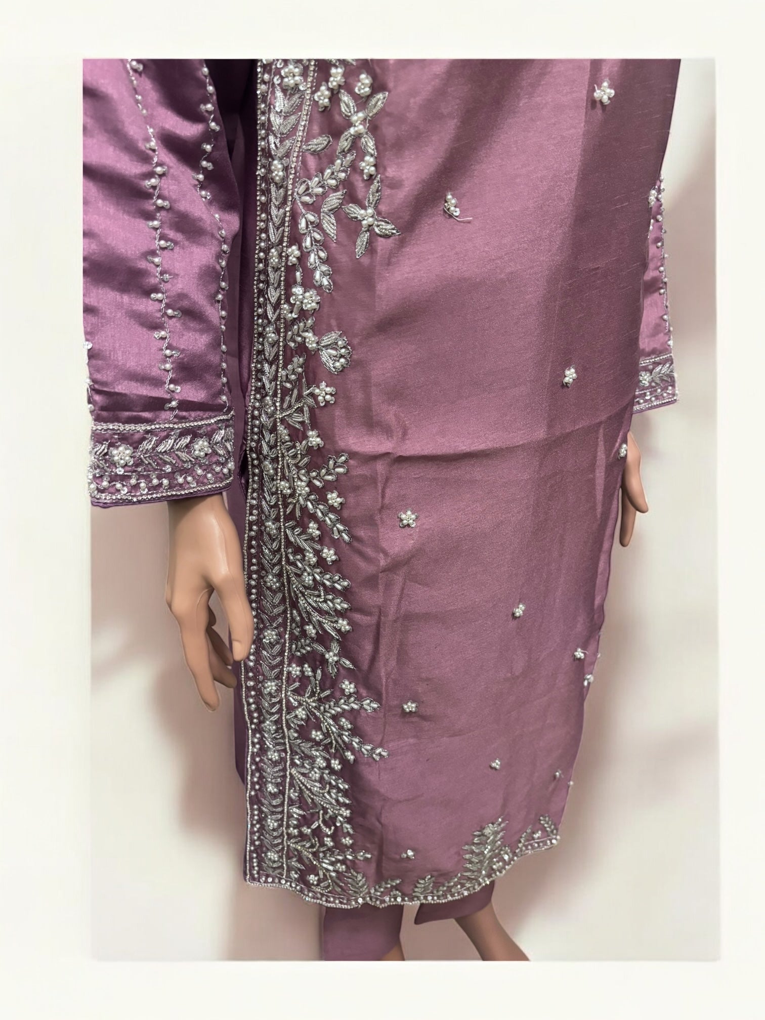 Traditional Salwar Kameez set by Saree Ghor Charlotte, ethnic women’s wear with detailed embroidery and vibrant fabric.
