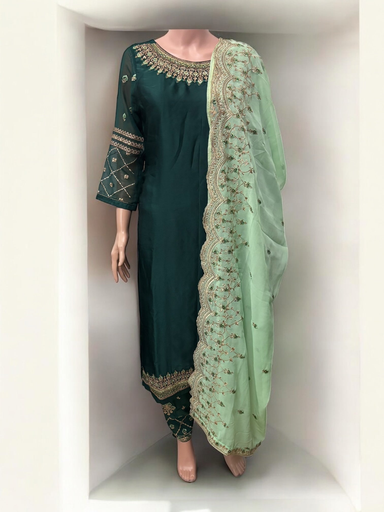 Traditional Salwar Kameez set by Saree Ghor Charlotte, elegant ethnic wear for women with intricate fabric and vibrant design.