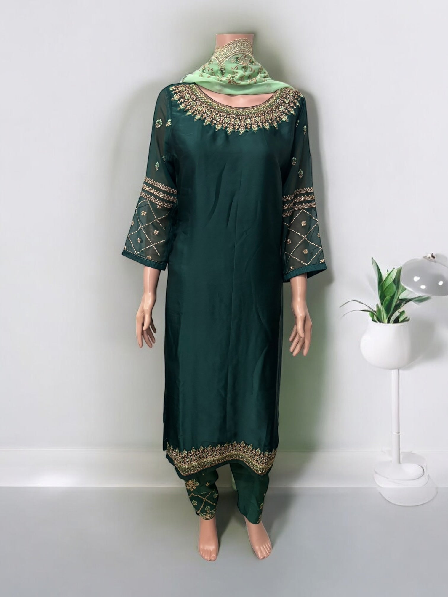 Traditional Saree Ghor Charlotte Salwar Kameez set for women featuring ethnic wear with intricate designs and vibrant colors.