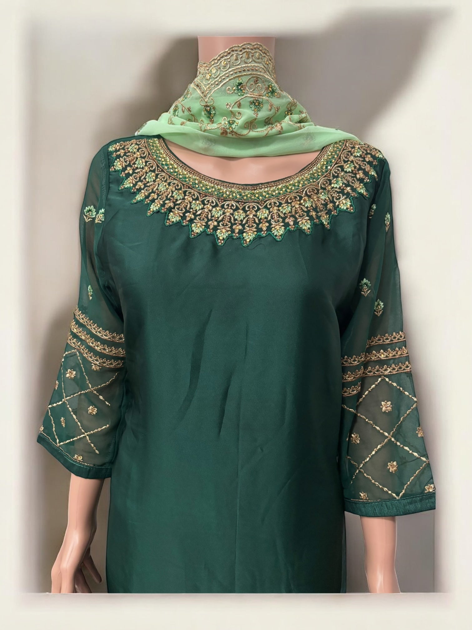 Traditional Saree Ghor Charlotte salwar kameez set for women, showcasing intricate ethnic wear with vibrant fabric and elegant design.