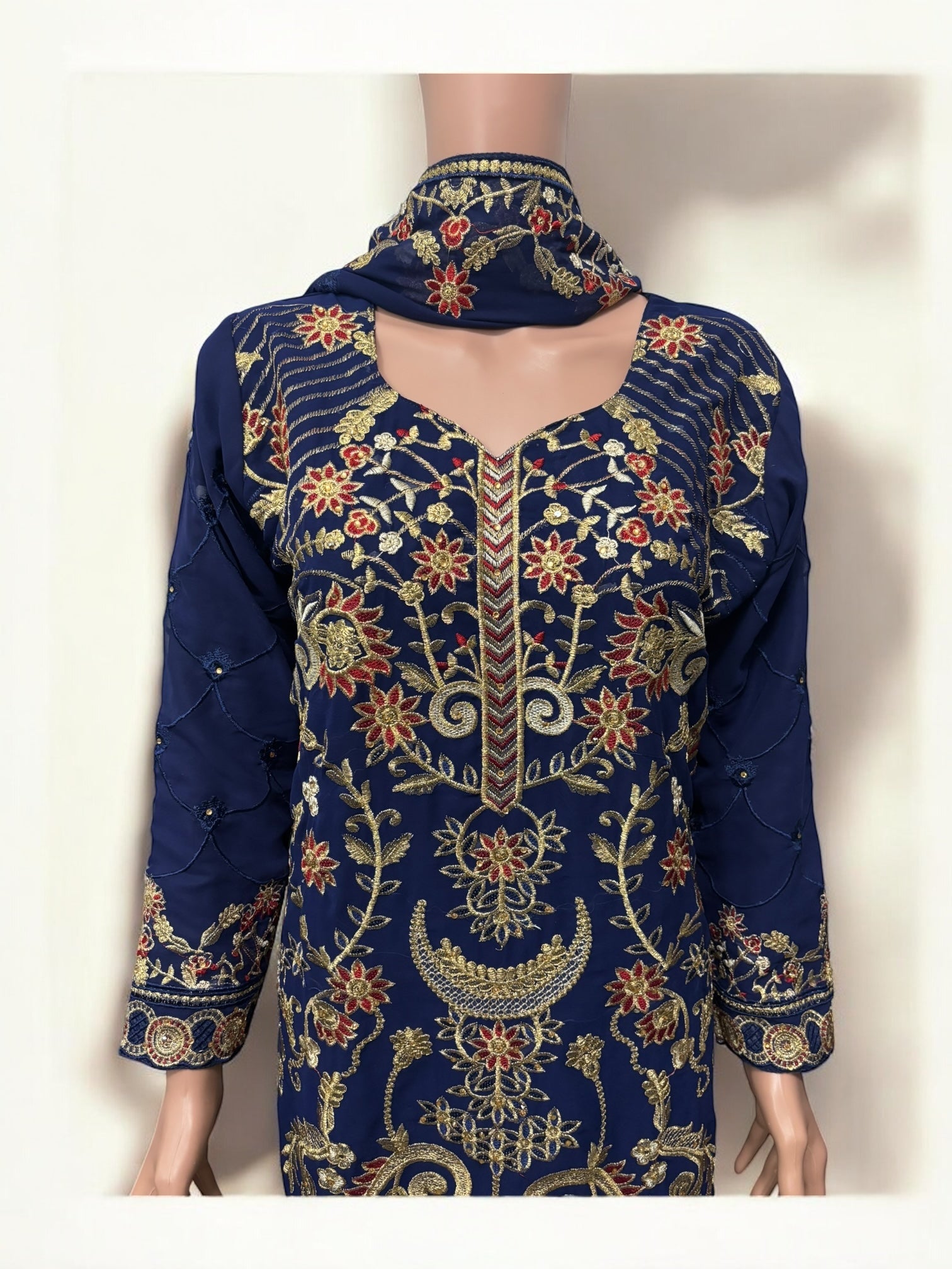 Traditional Salwar Kameez set by Saree Ghor Charlotte, elegant ethnic wear for women featuring intricate embroidery and vibrant fabric.