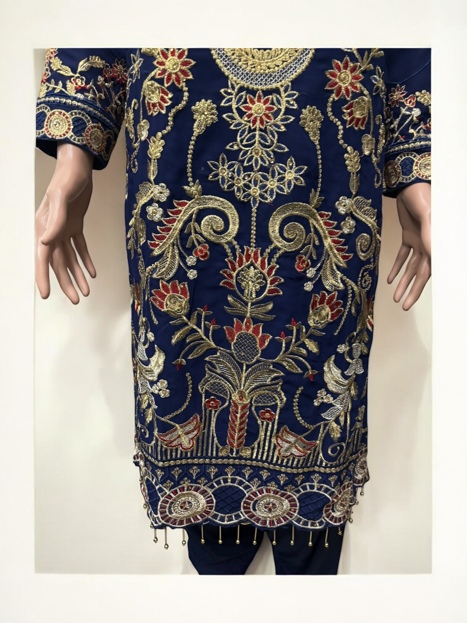 Traditional Salwar Kameez set by Saree Ghor Charlotte, elegant ethnic wear for women with intricate embroidery and vibrant fabric.