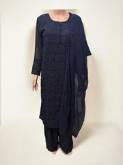 Traditional Salwar Kameez set by Saree Ghor Charlotte, ethnic women’s wear with intricate patterns and vibrant fabric.